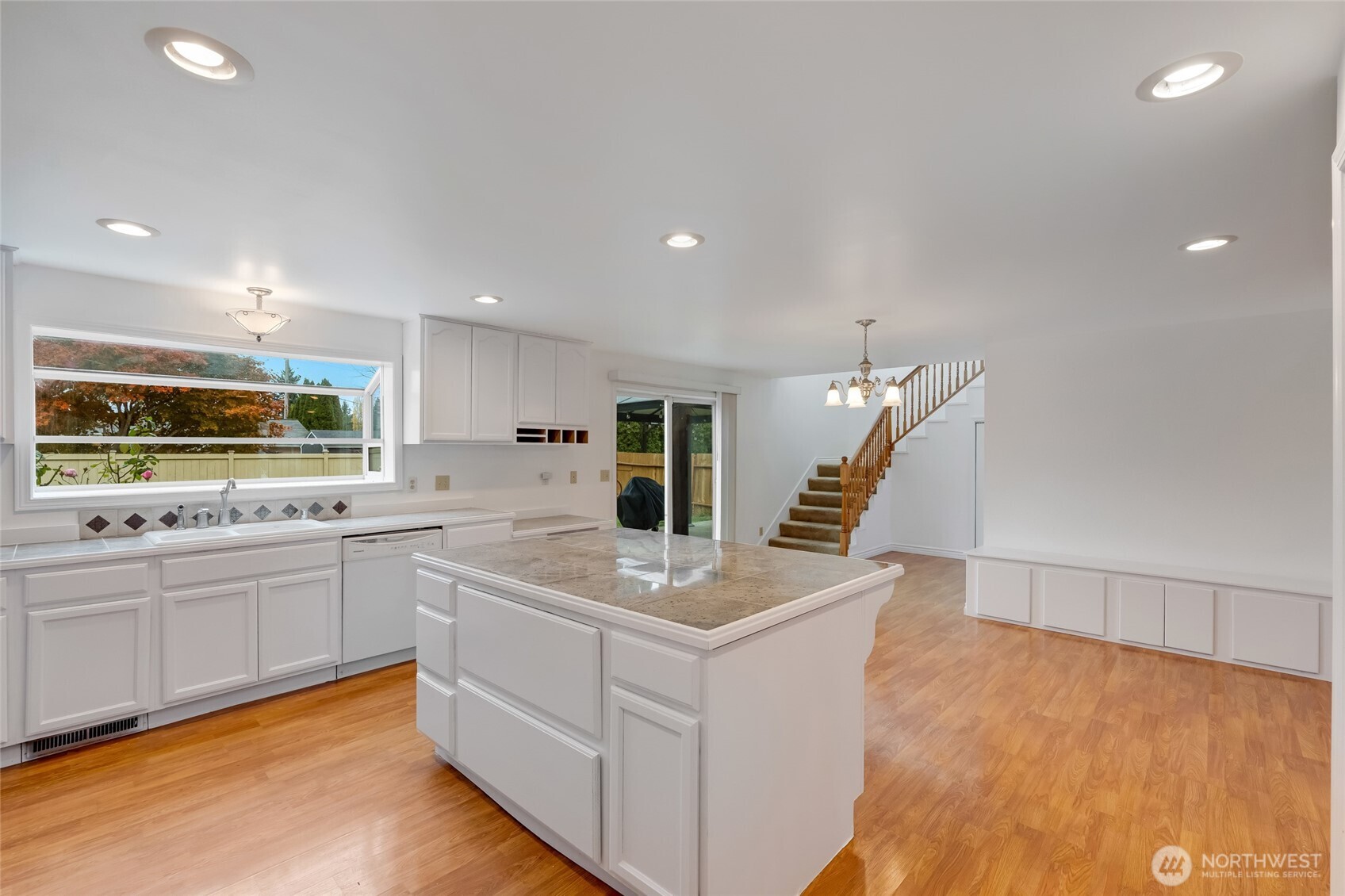 12649 Southeast 169th Place Renton, WA 98058 - Photo 9 of 38 a kitchen with white cabinets and sink