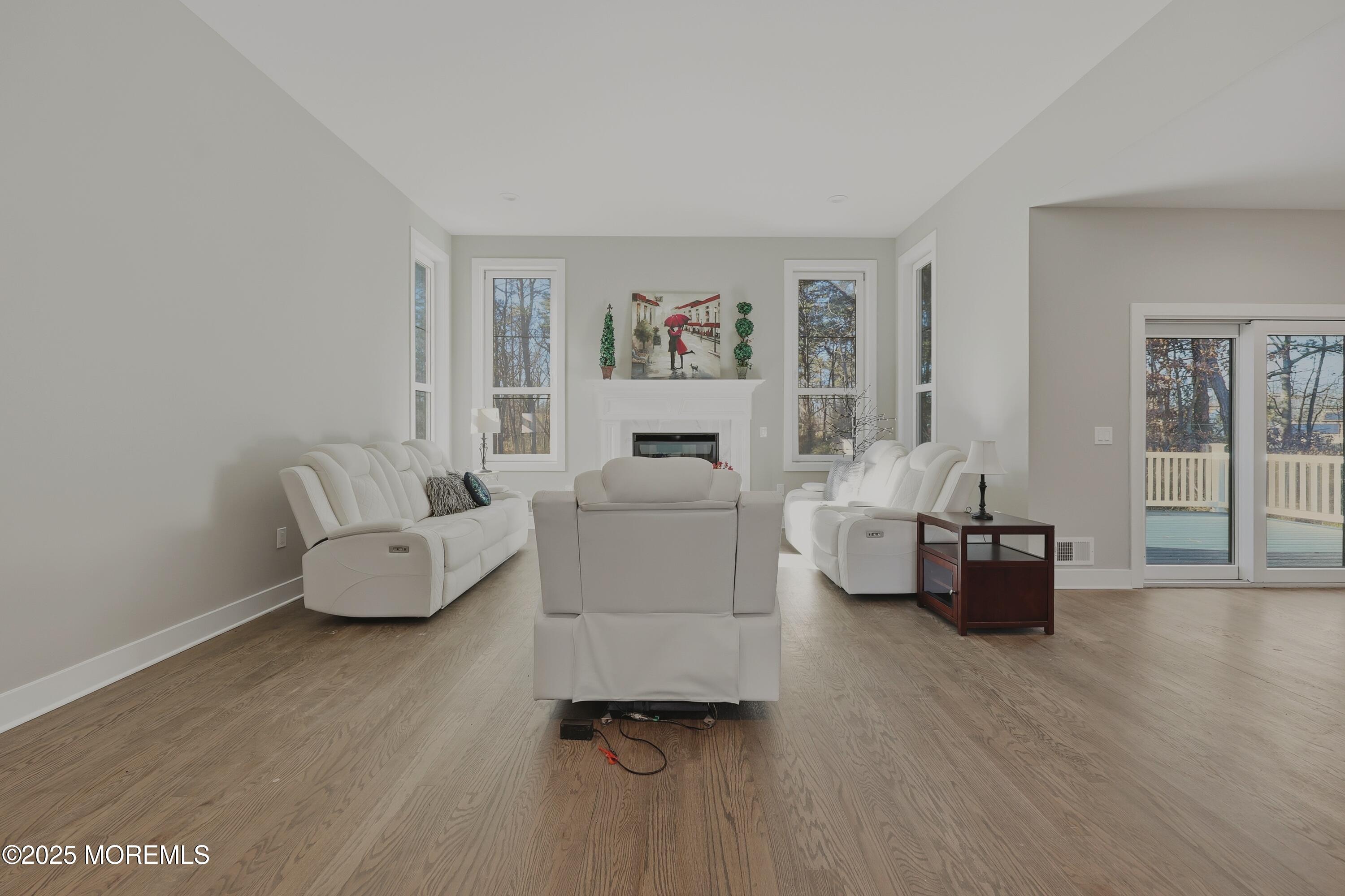 2 Haystack Court Howell, NJ 07731 - Photo 11 of 78 a living room with furniture and a hard wood floor