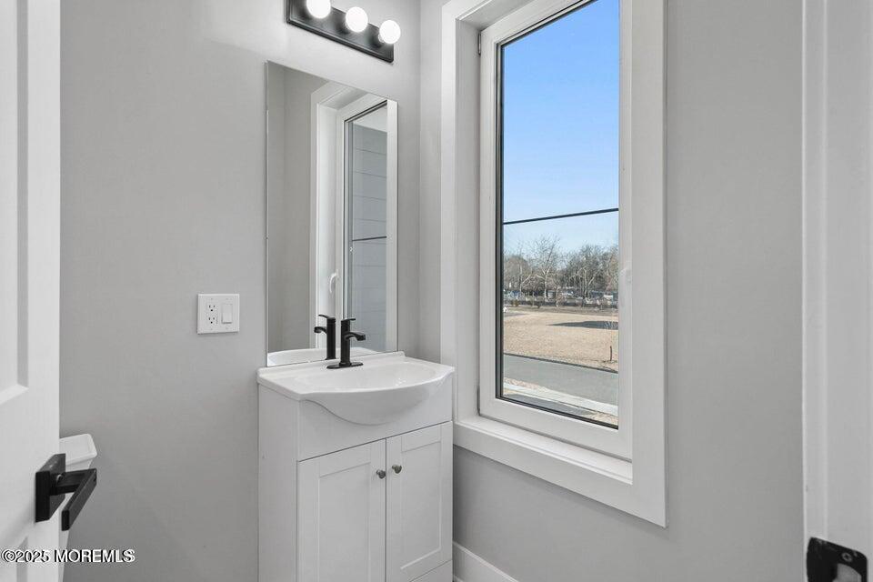 2 Haystack Court Howell, NJ 07731 - Photo 24 of 78 a bathroom with a sink and a mirror