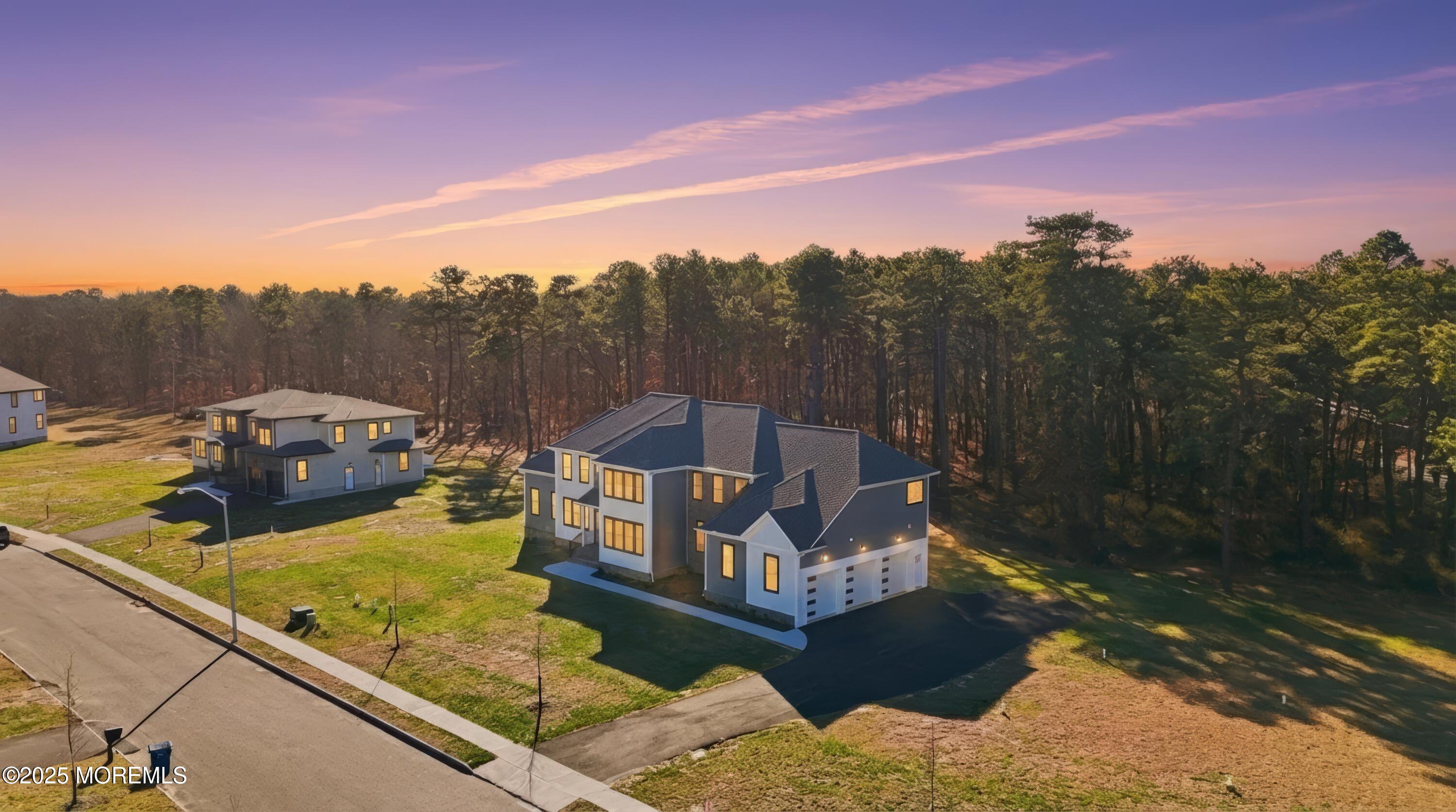 2 Haystack Court Howell, NJ 07731 - Photo 55 of 78 drone side angle sun set