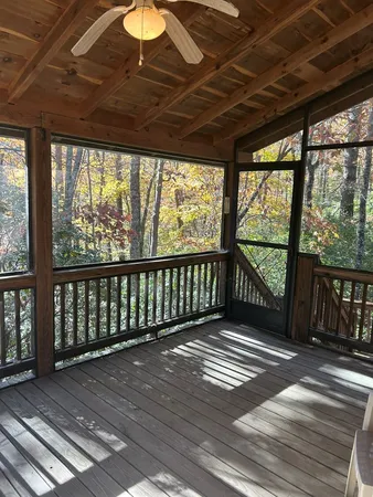 a view of outdoor space with wooden floor