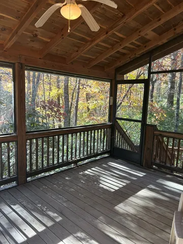 a view of outdoor space with wooden floor