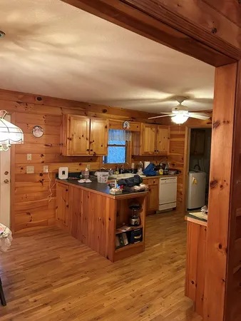 a bedroom with a bed dresser and a window