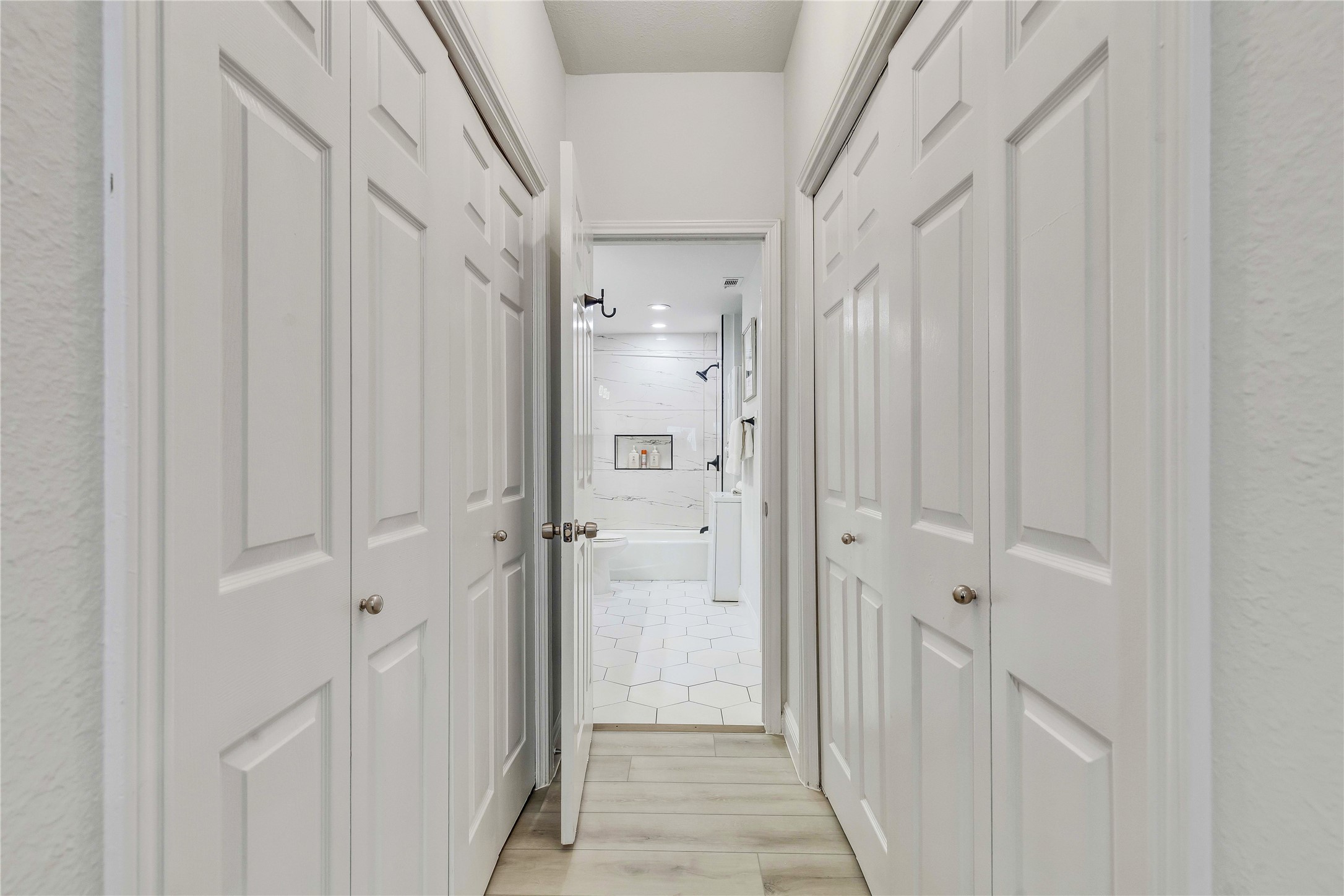 2529 Rio Grande Street, Unit 56 Austin, TX 78705 - Photo 13 of 16 Corridor with light wood-style floors