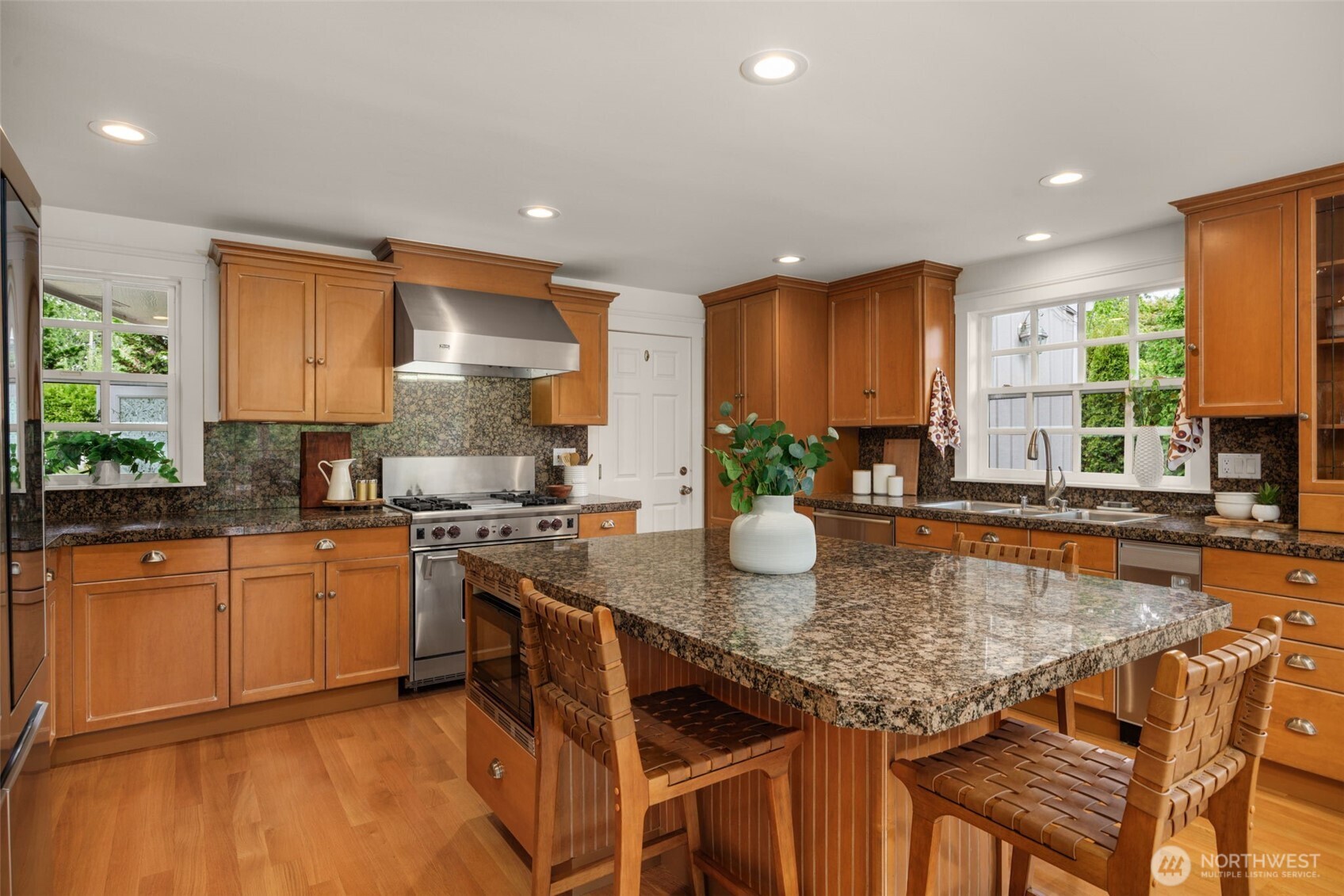 3204 Evergreen Point Road Medina, WA 98039 - Photo 11 of 39 a kitchen with stainless steel appliances granite countertop wooden cabinets a stove top oven a sink and dishwasher