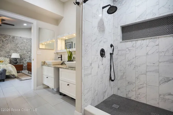 a bathroom with a sink and a shower