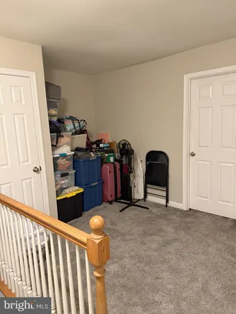 a view of workspace with furniture and closet