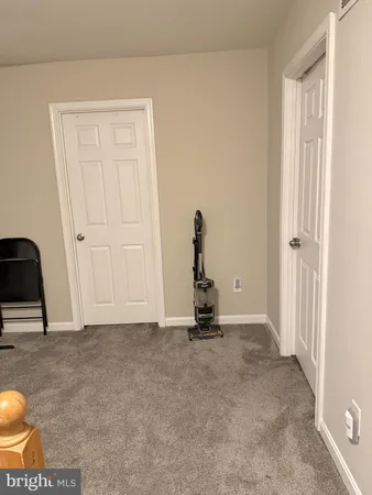 a bathroom with a toilet and a shower curtain