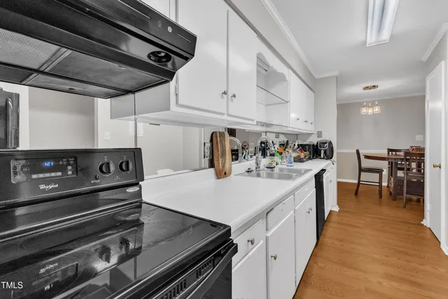 a kitchen with a stove and a refrigerator