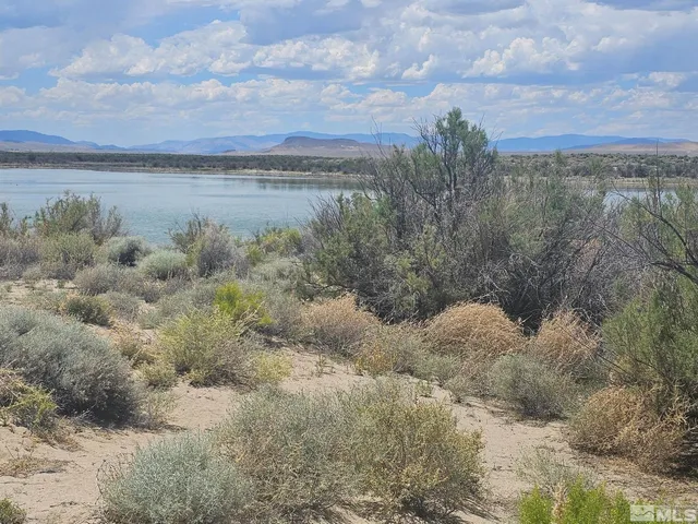 a view of a lake with mountains in the background