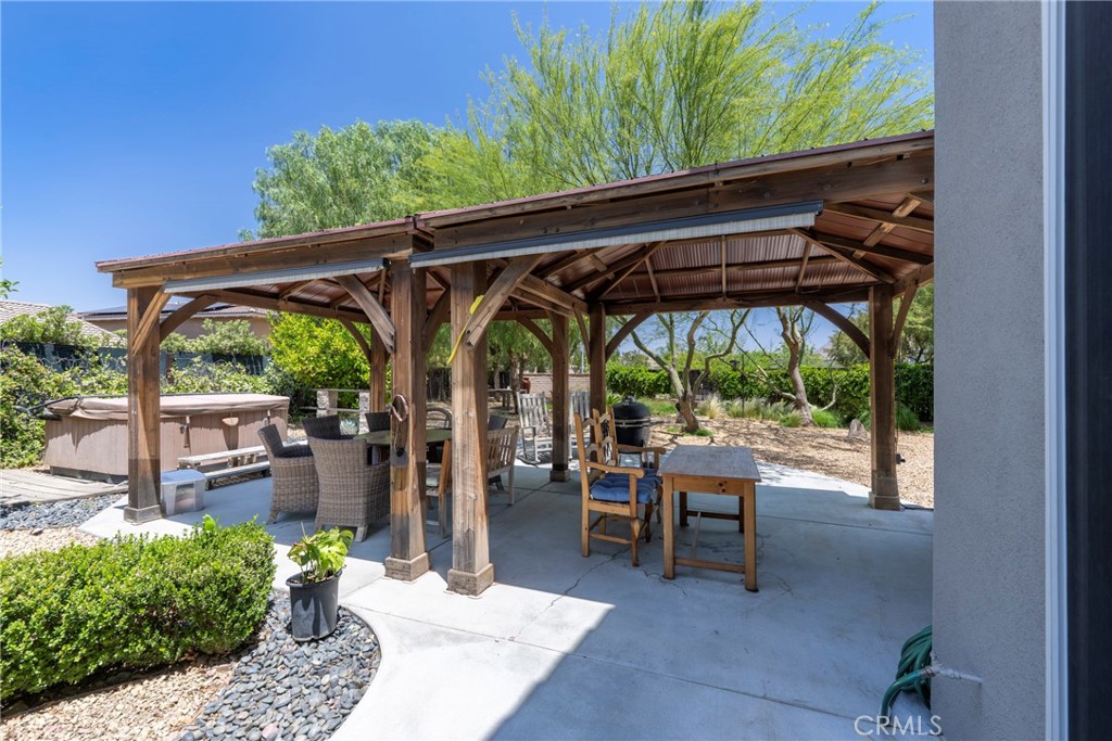 3819 St Austell Way Perris, CA 92571 - Photo 50 of 64 a view of patio with chairs and potted plants