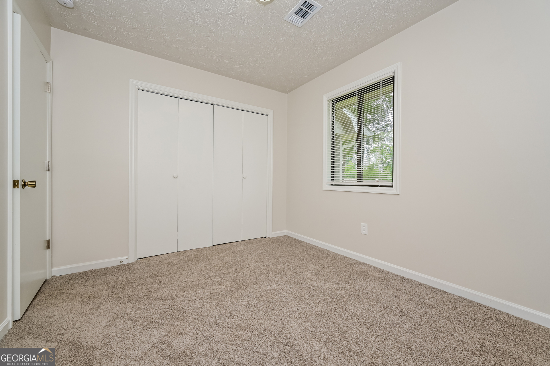 2140 Teri Lane Southeast Conyers, GA 30013 - Photo 13 of 16 an empty room with windows