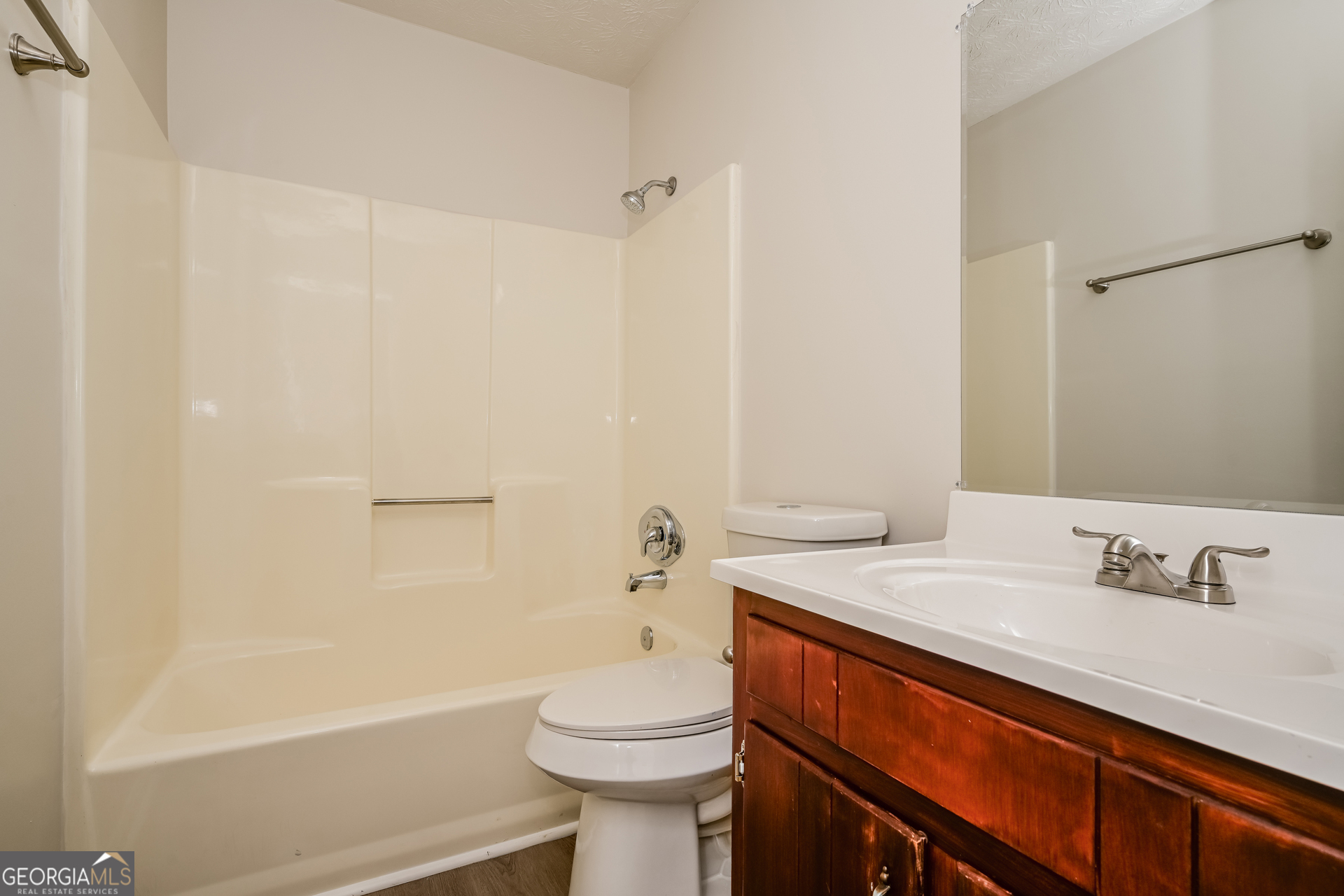 2140 Teri Lane Southeast Conyers, GA 30013 - Photo 14 of 16 a bathroom with a sink a toilet and shower