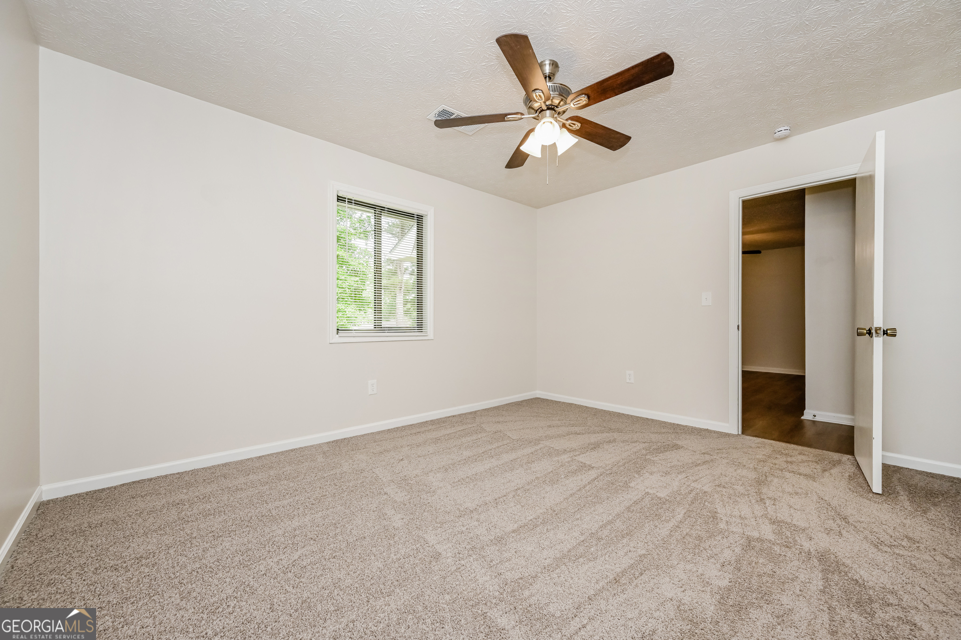 2140 Teri Lane Southeast Conyers, GA 30013 - Photo 7 of 16 an empty room with closet and windows