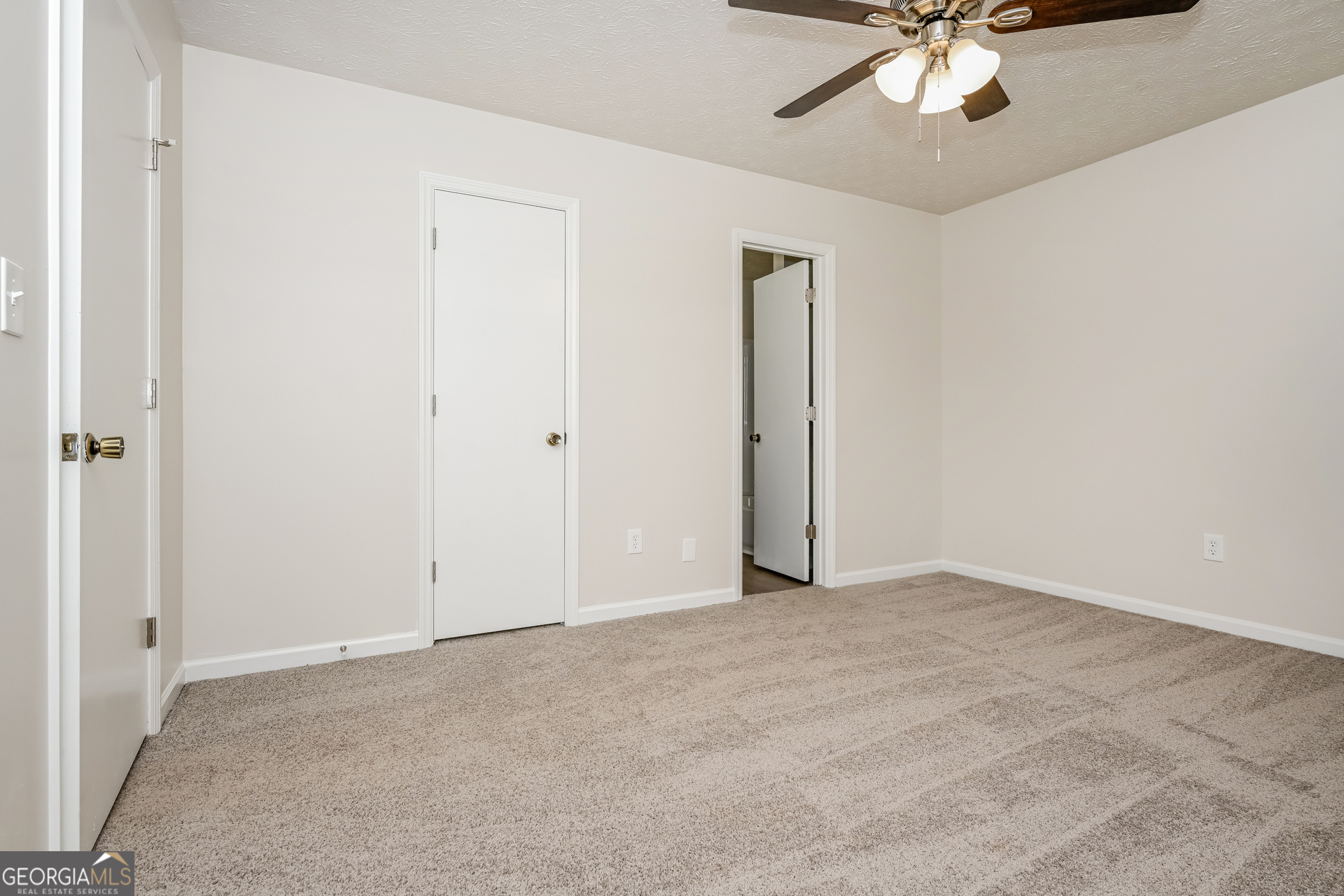 2140 Teri Lane Southeast Conyers, GA 30013 - Photo 8 of 16 an empty room with a chandelier fan