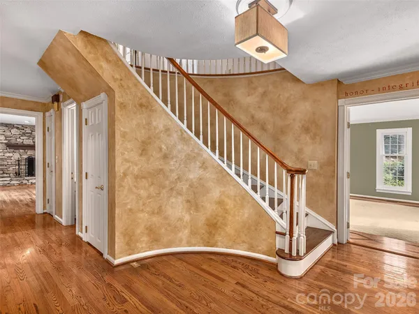 a view of entryway with wooden floor