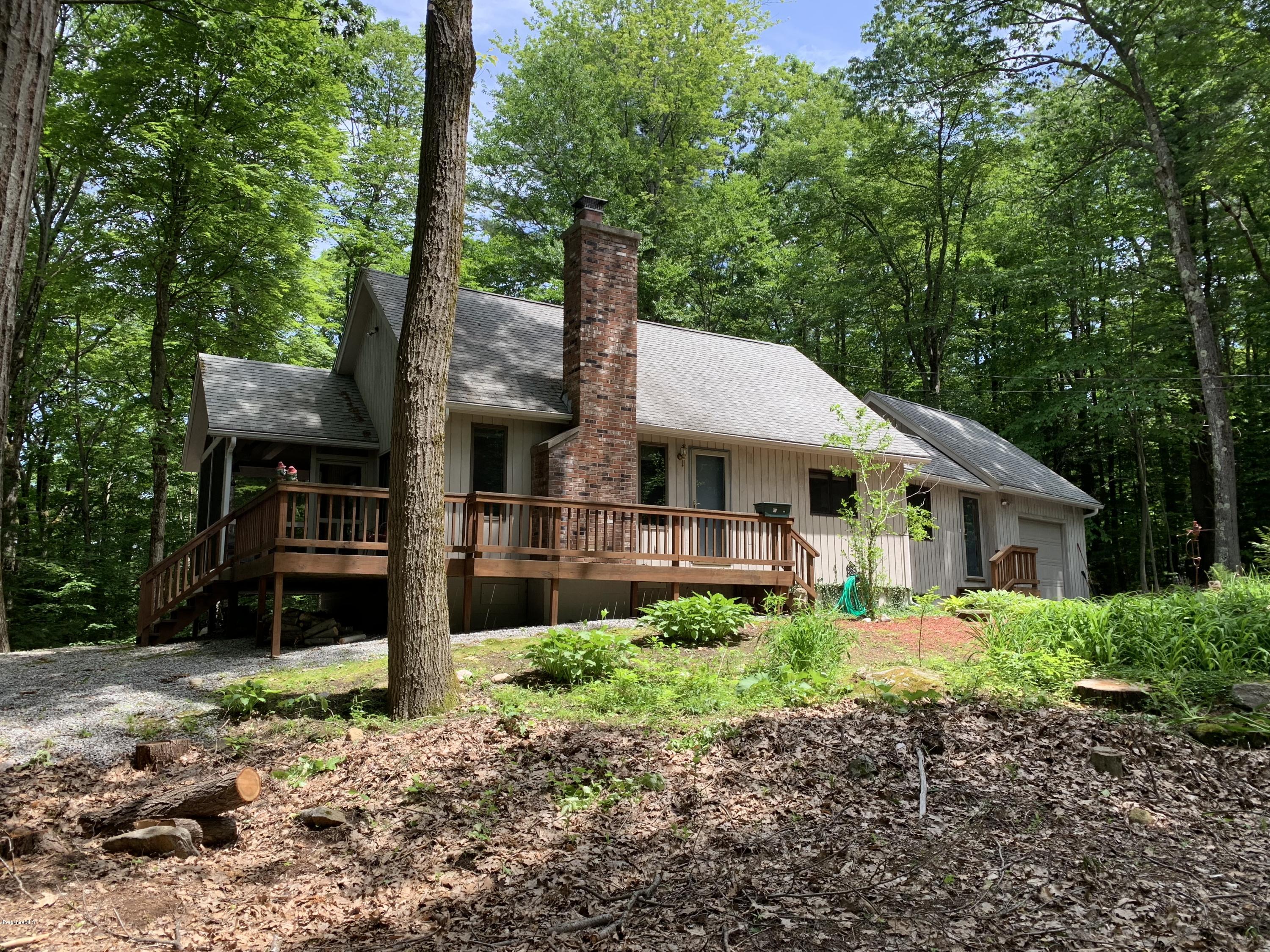 29 Pinnacle Road Otis, MA 01253 - Photo 1 of 37 a front view of a house with garden