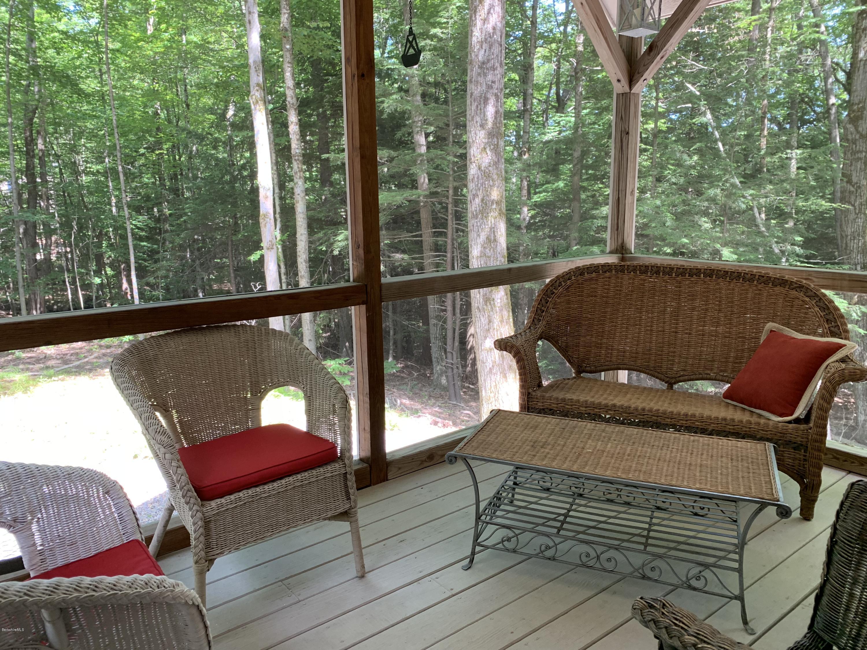 29 Pinnacle Road Otis, MA 01253 - Photo 15 of 37 a view of a chair and table in the balcony