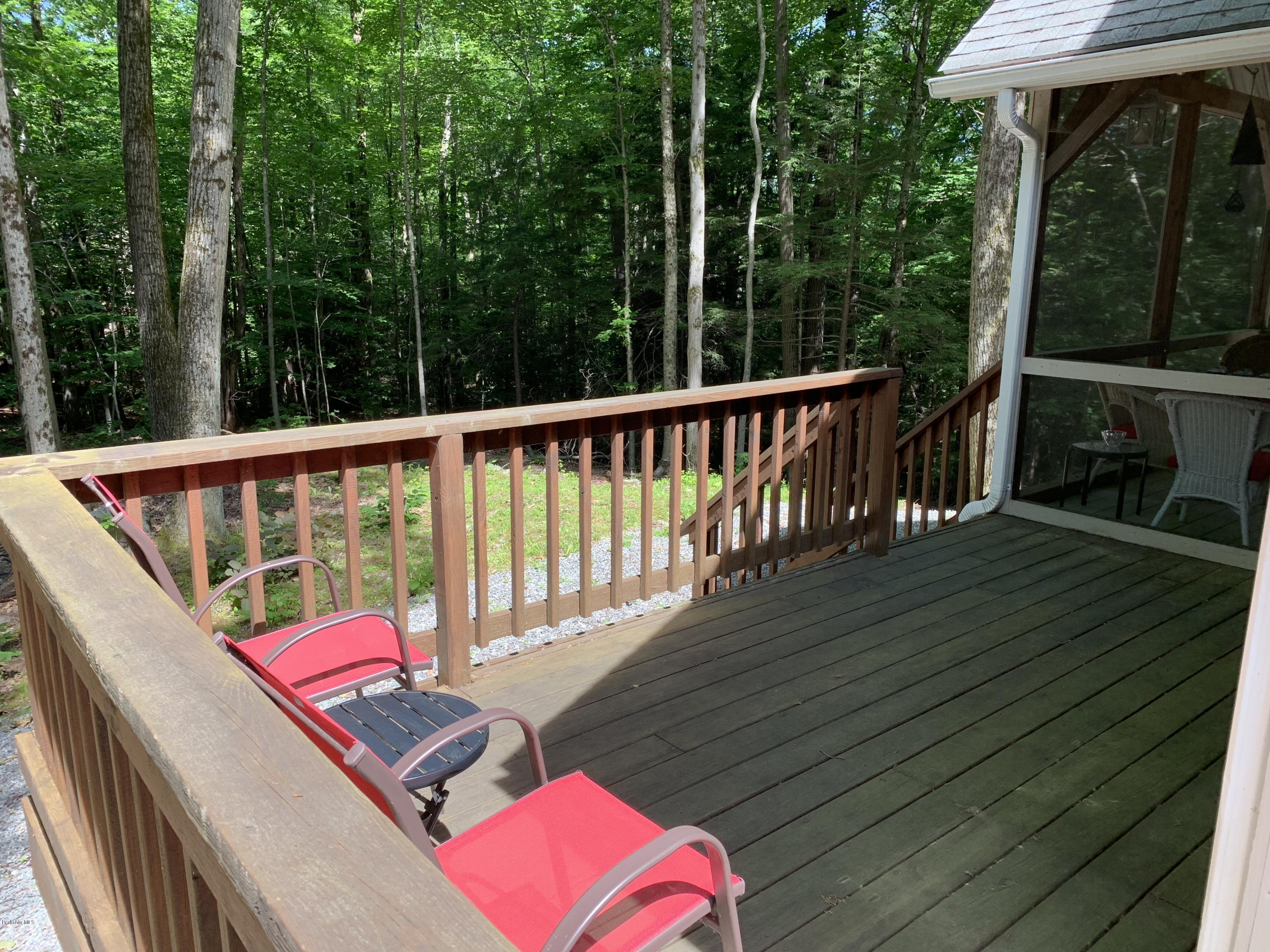 29 Pinnacle Road Otis, MA 01253 - Photo 16 of 37 a balcony with wooden floor and outdoor seating