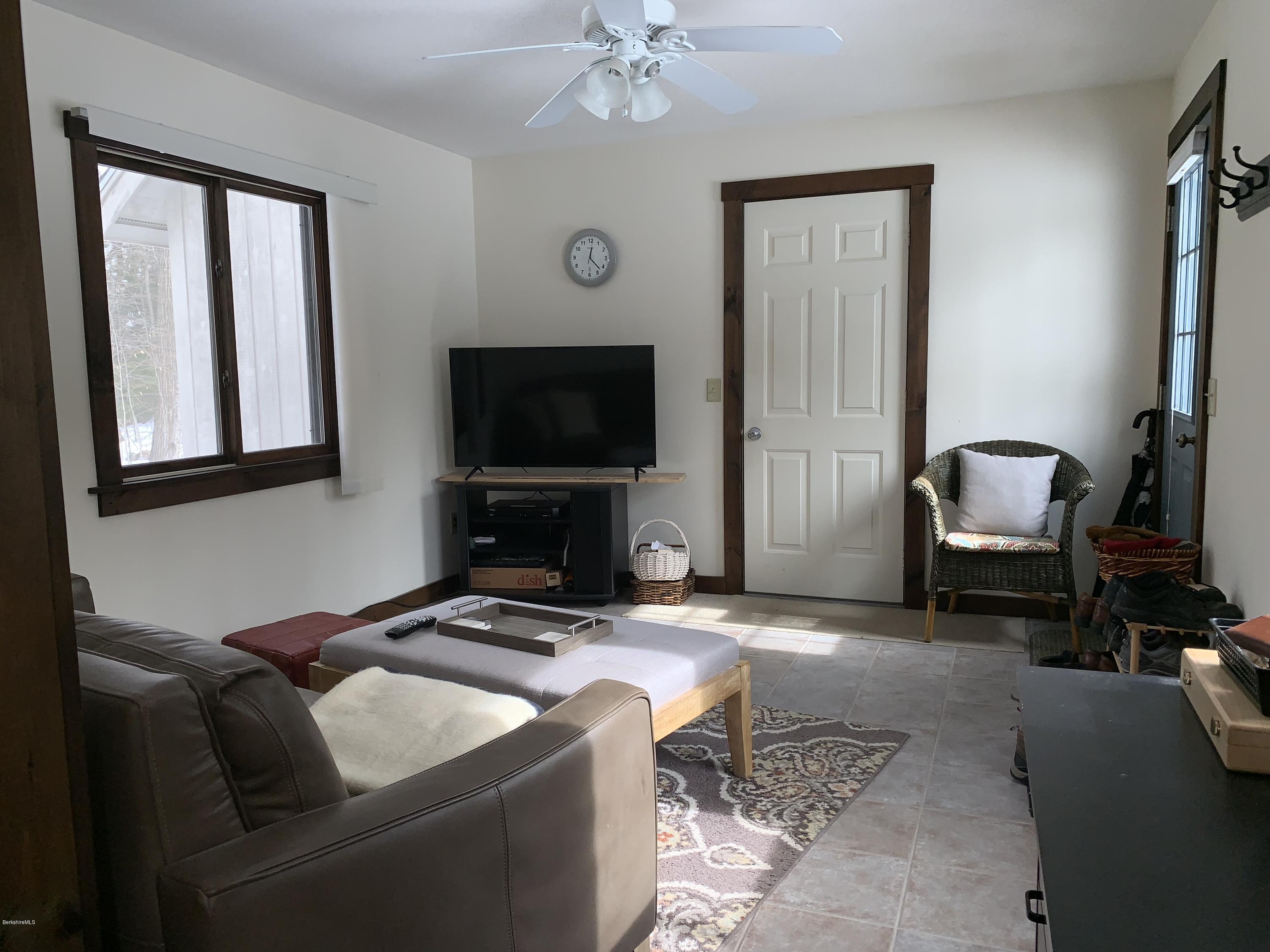 29 Pinnacle Road Otis, MA 01253 - Photo 26 of 37 a living room with furniture and a flat screen tv