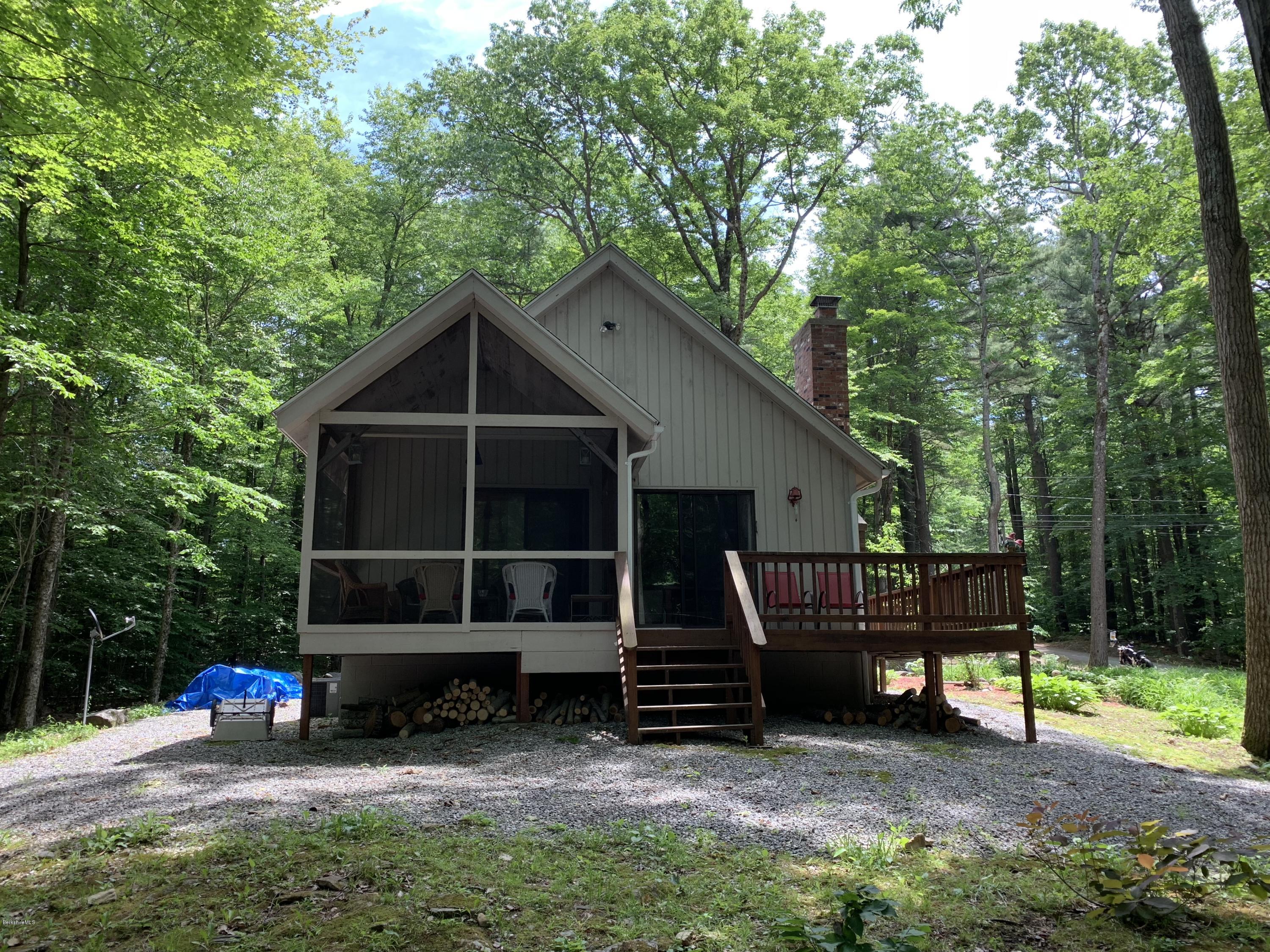 29 Pinnacle Road Otis, MA 01253 - Photo 30 of 37 a view of a wooden house with a yard and large trees