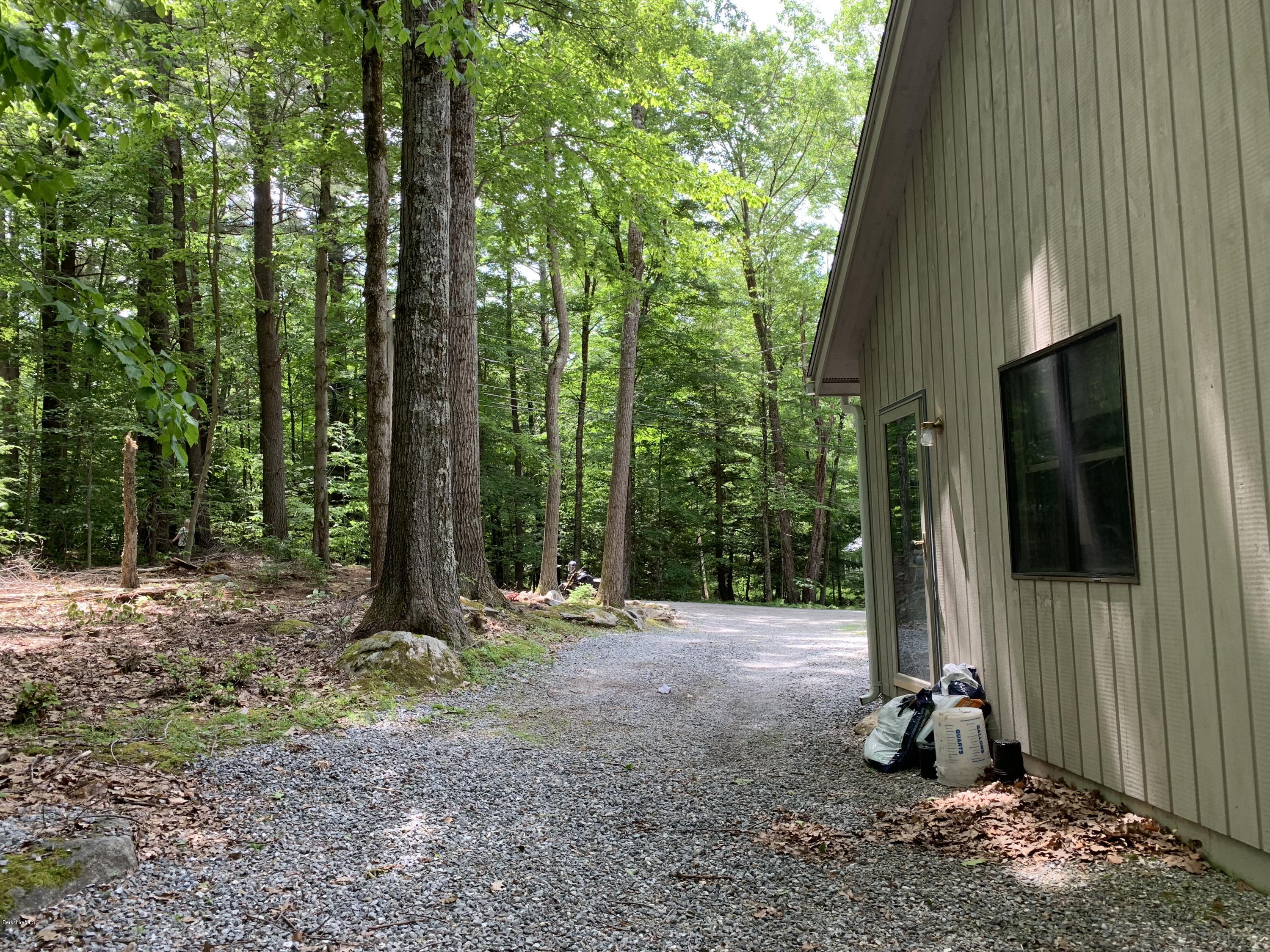 29 Pinnacle Road Otis, MA 01253 - Photo 32 of 37 a backyard of a house with lots of green space