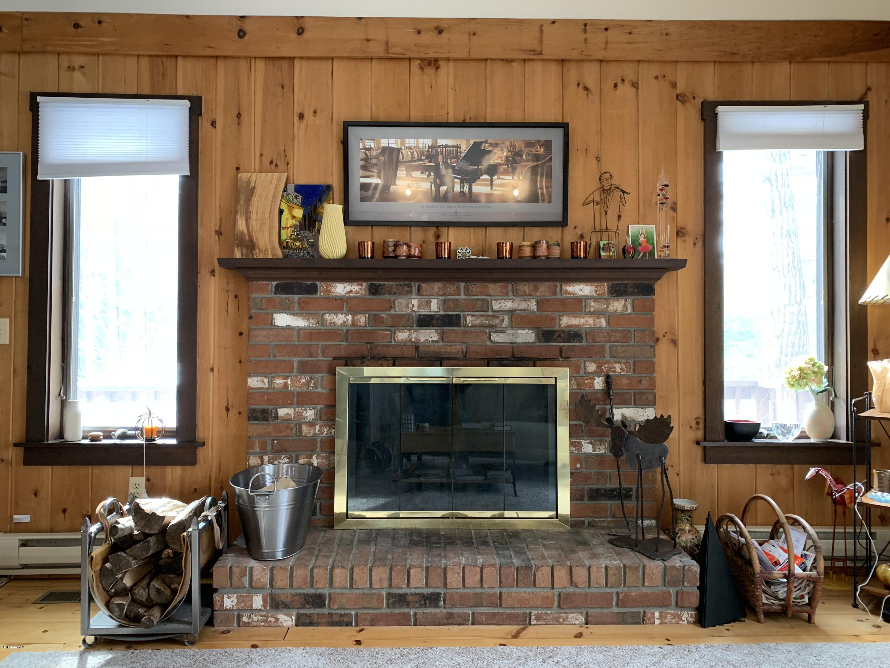 29 Pinnacle Road Otis, MA 01253 - Photo 7 of 37 a living room with furniture a fireplace and a flat screen tv