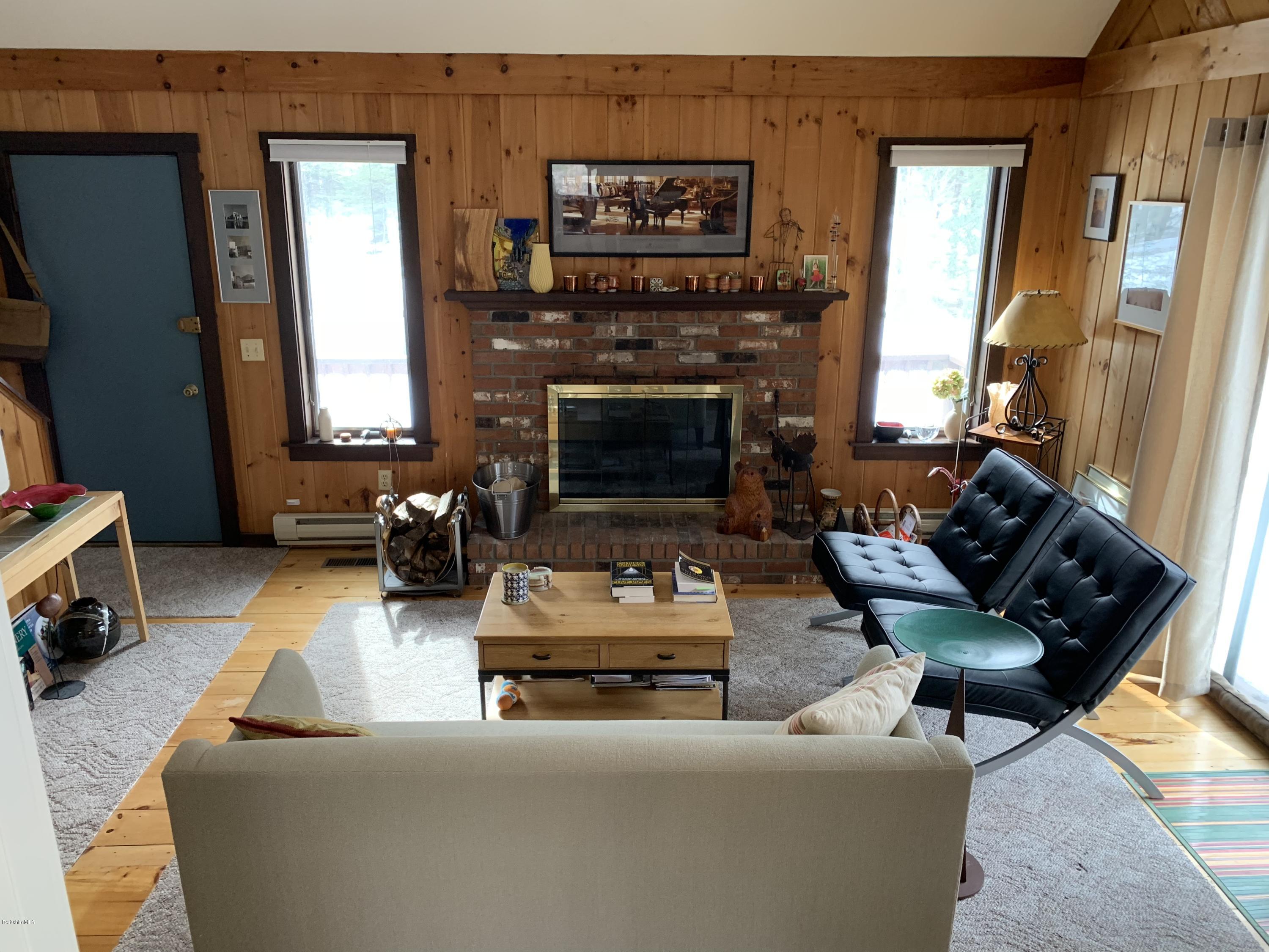 29 Pinnacle Road Otis, MA 01253 - Photo 8 of 37 a living room with furniture and a fireplace