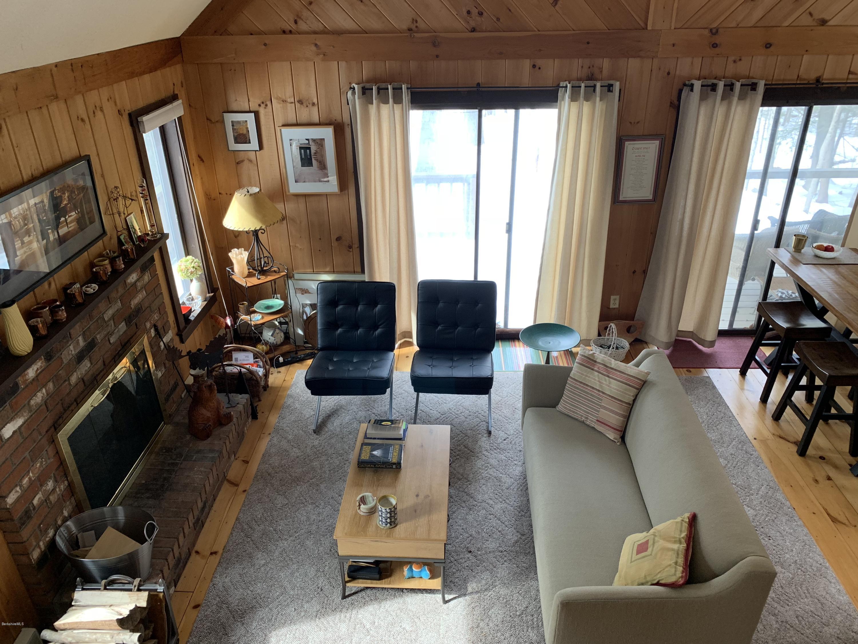 29 Pinnacle Road Otis, MA 01253 - Photo 9 of 37 a living room with furniture and a flat screen tv