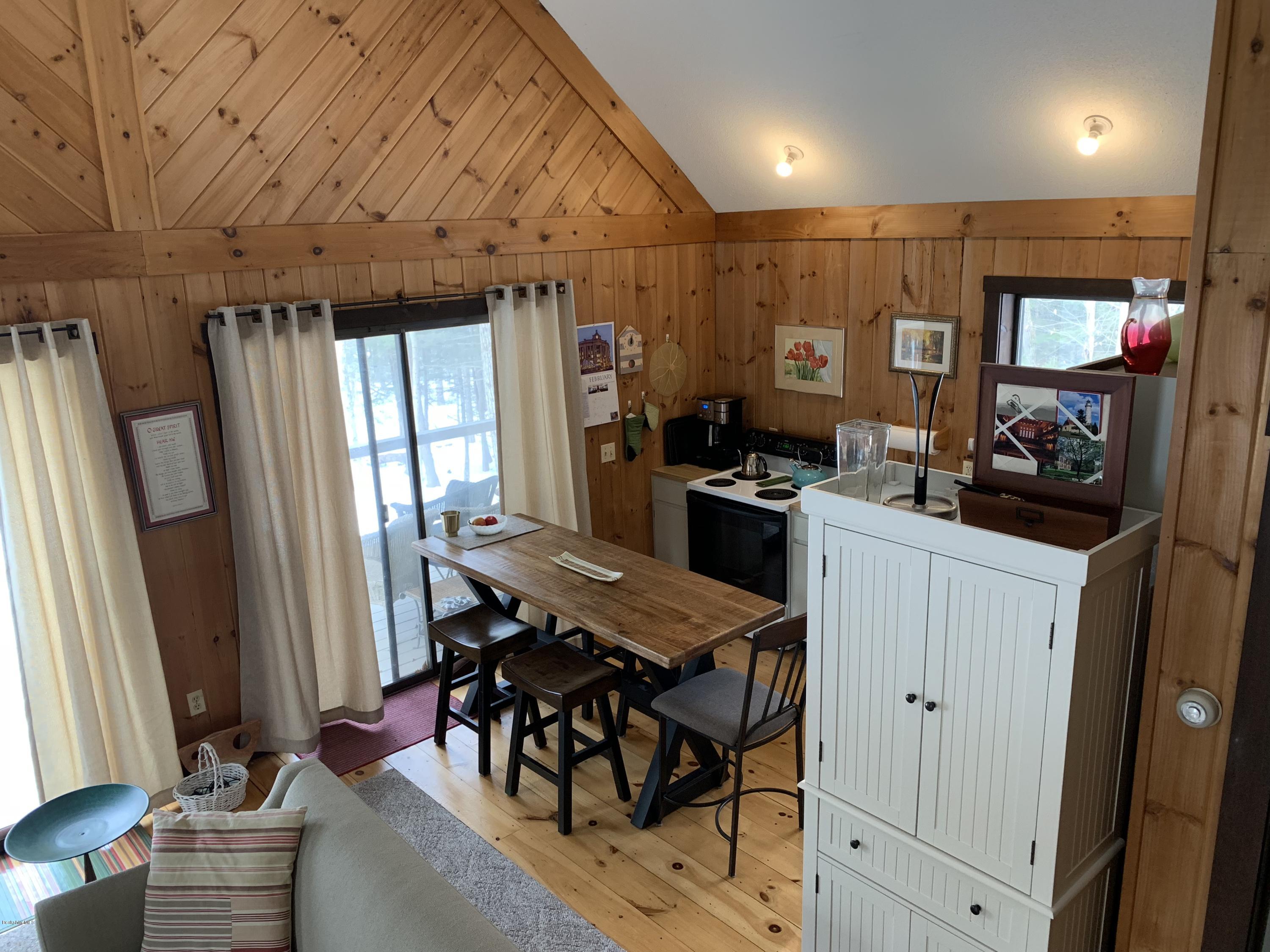 29 Pinnacle Road Otis, MA 01253 - Photo 10 of 37 a view of a dining room with furniture window and wooden floor