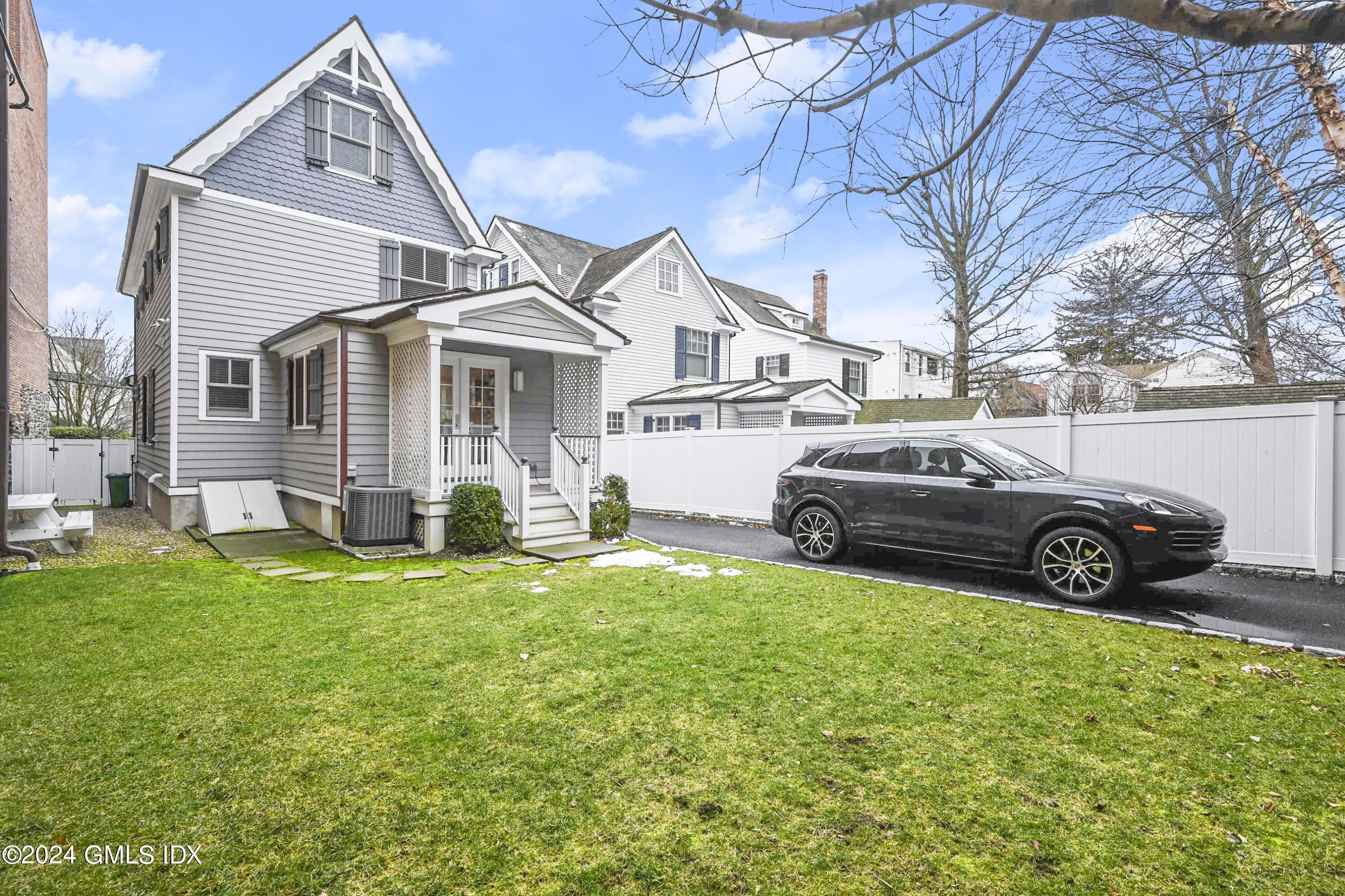 13 Grigg Street Greenwich, CT 06830 - Photo 13 of 30 a view of a house with a big yard and a large tree