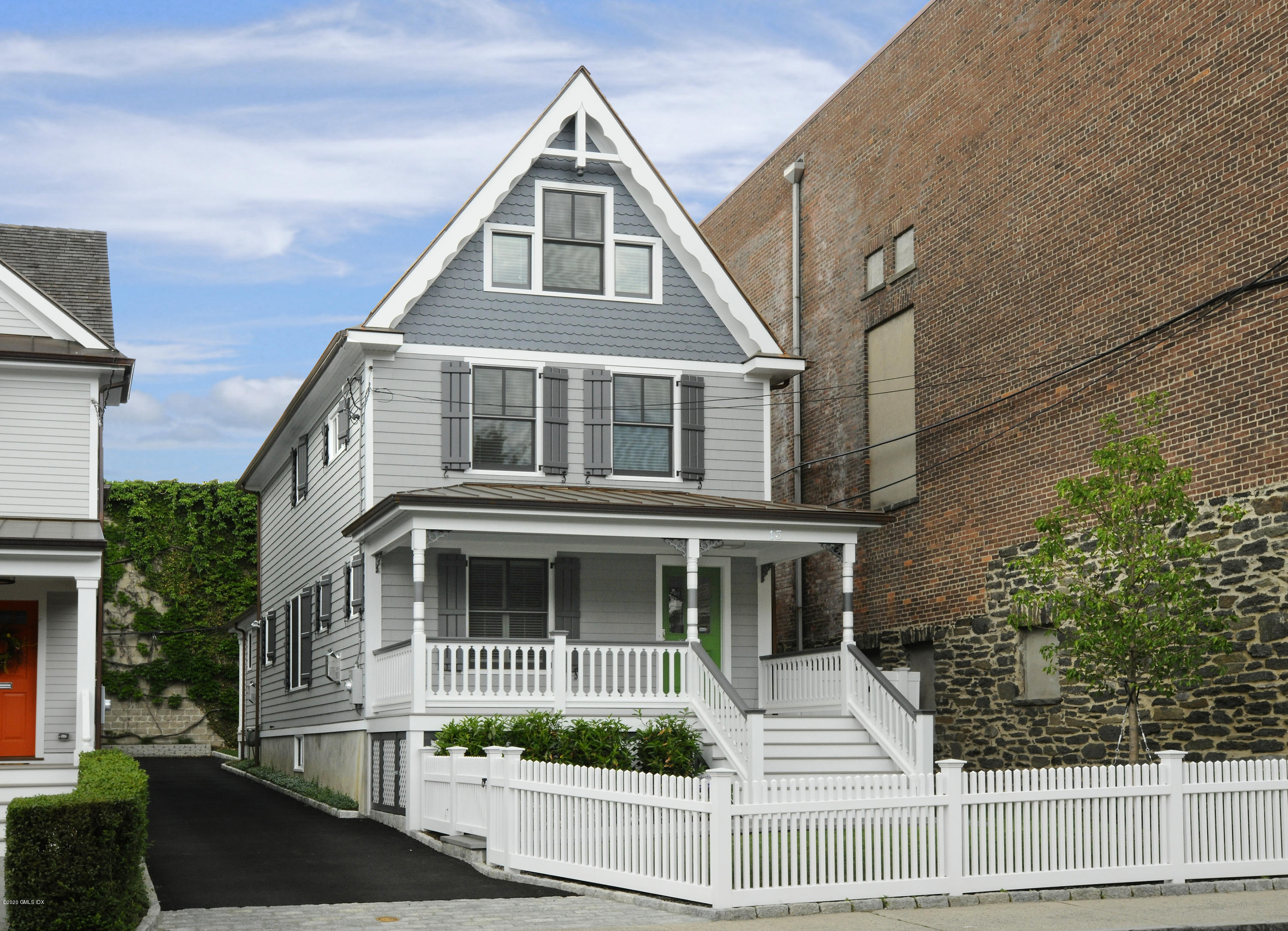 13 Grigg Street Greenwich, CT 06830 - Photo 18 of 30 a front view of a house with a yard