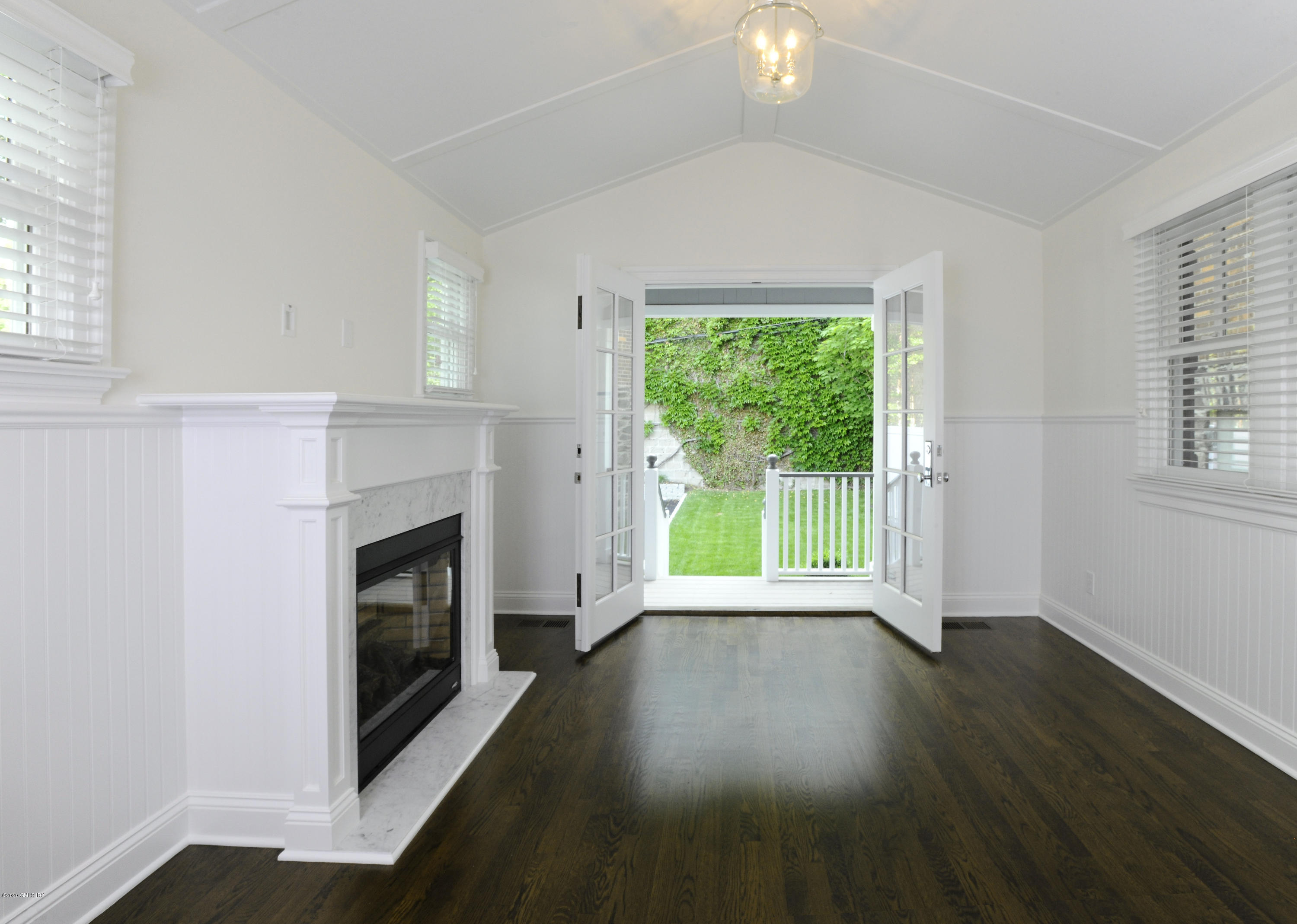 13 Grigg Street Greenwich, CT 06830 - Photo 22 of 30 a view of empty room with wooden floor and fan