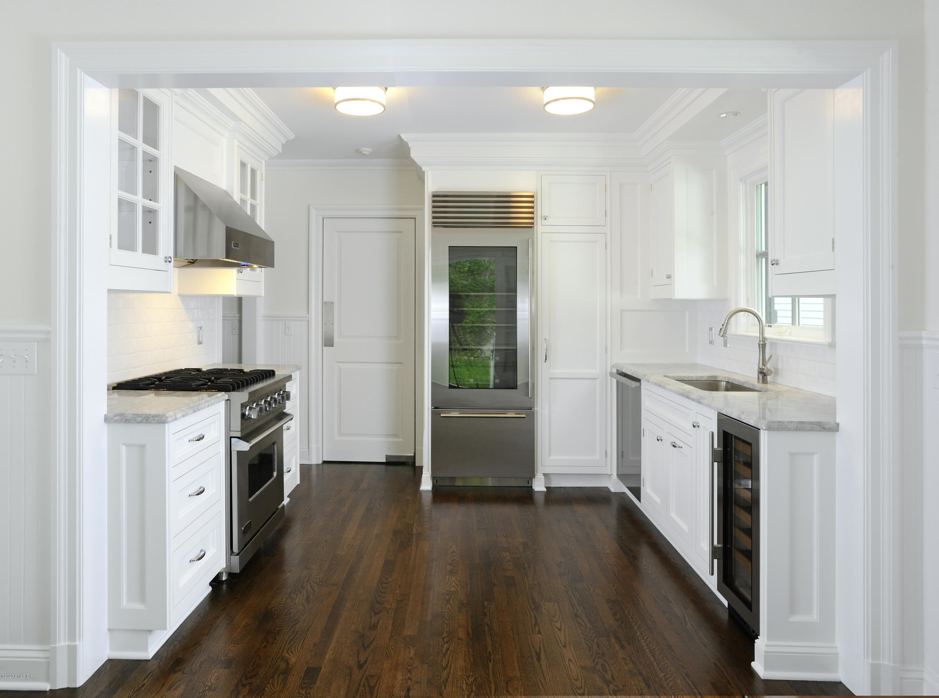 13 Grigg Street Greenwich, CT 06830 - Photo 26 of 30 a kitchen with a stove a sink and a refrigerator