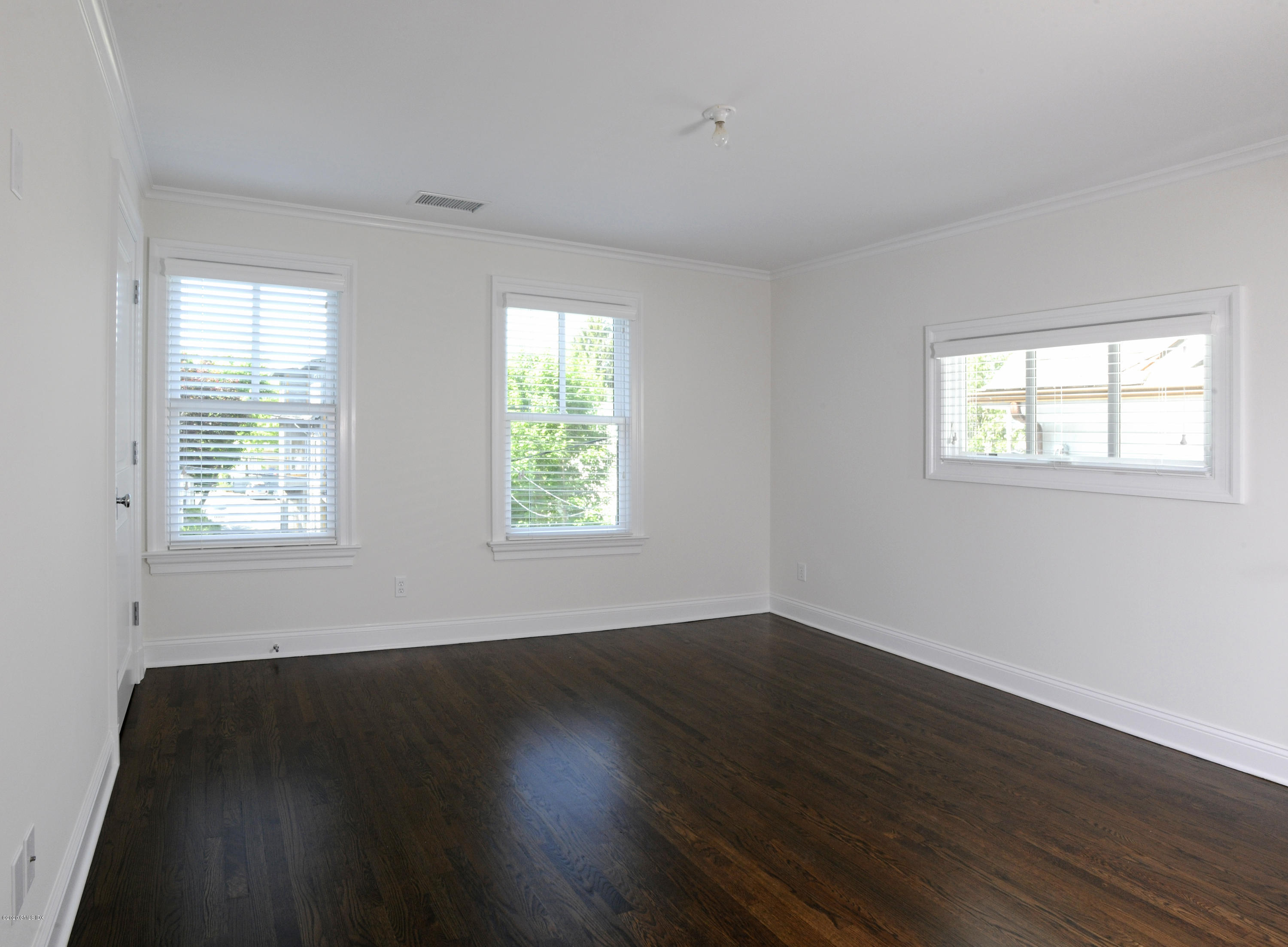 13 Grigg Street Greenwich, CT 06830 - Photo 28 of 30 a view of an empty room with wooden floor and a window