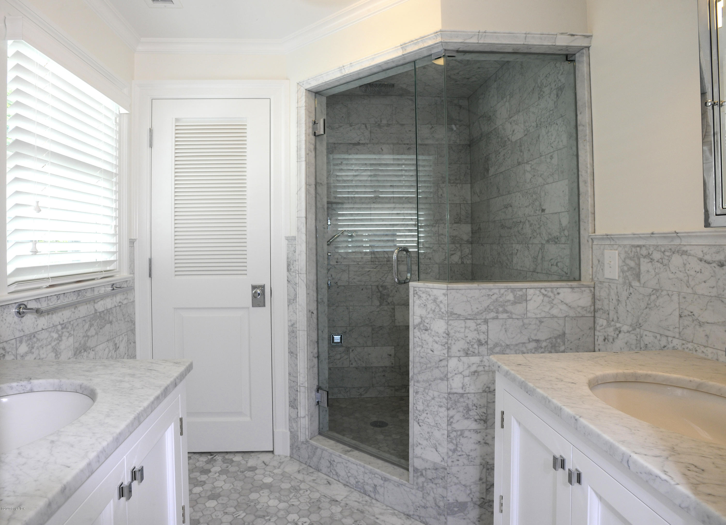 13 Grigg Street Greenwich, CT 06830 - Photo 29 of 30 a bathroom with a granite countertop sink a shower and a bathtub