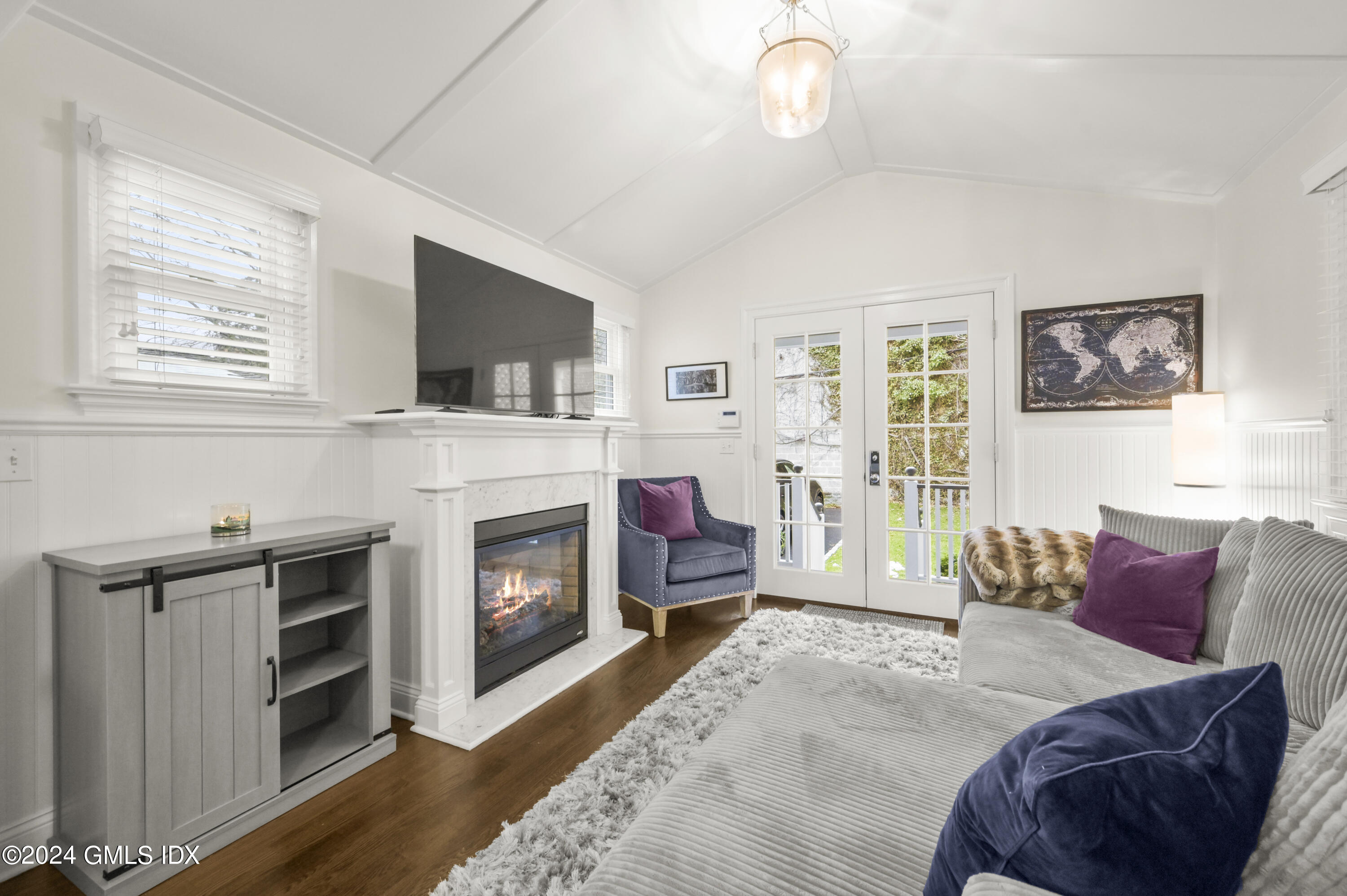 13 Grigg Street Greenwich, CT 06830 - Photo 7 of 30 a bedroom with a bed and a fireplace