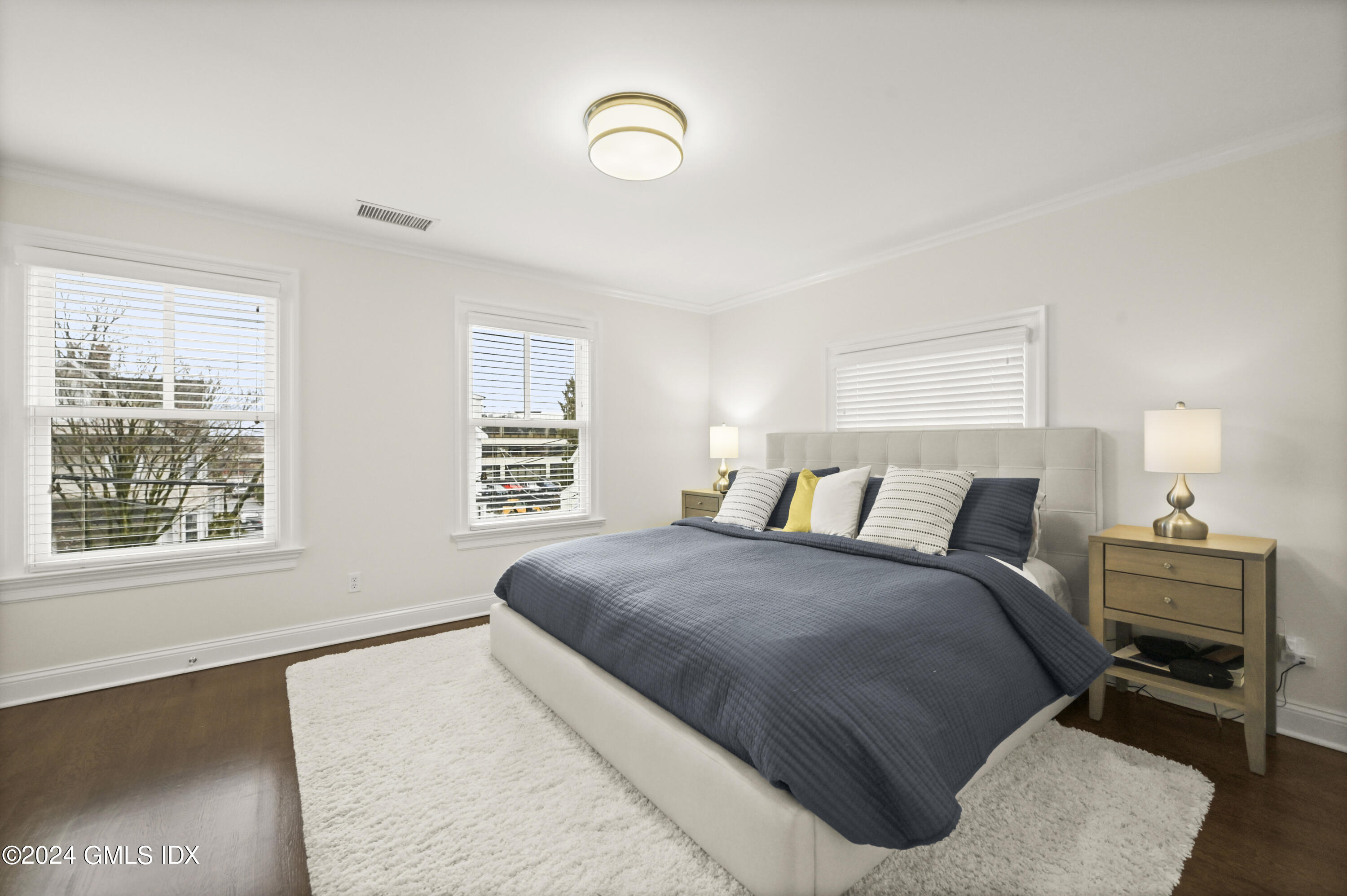 13 Grigg Street Greenwich, CT 06830 - Photo 9 of 30 a bedroom with a bed and a window