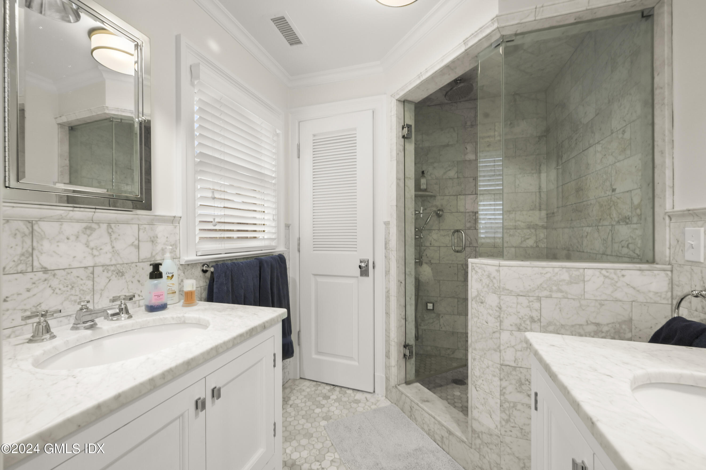 13 Grigg Street Greenwich, CT 06830 - Photo 10 of 30 a bathroom with a sink and a mirror