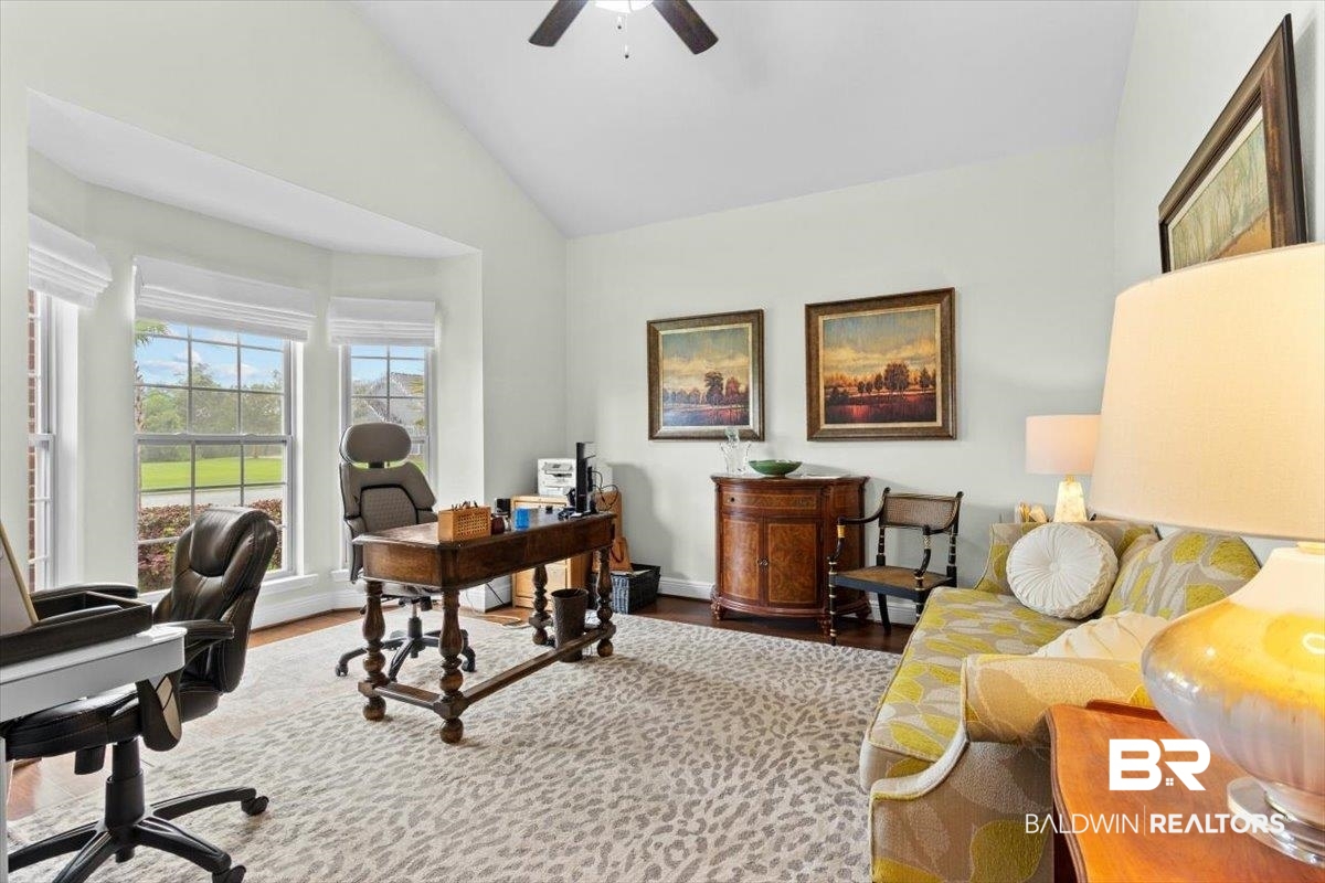 7056 Rocky Rd Loop Gulf Shores, AL 36542 - Photo 16 of 41 Office space featuring wood finished floors, a ceiling fan, and high vaulted ceiling