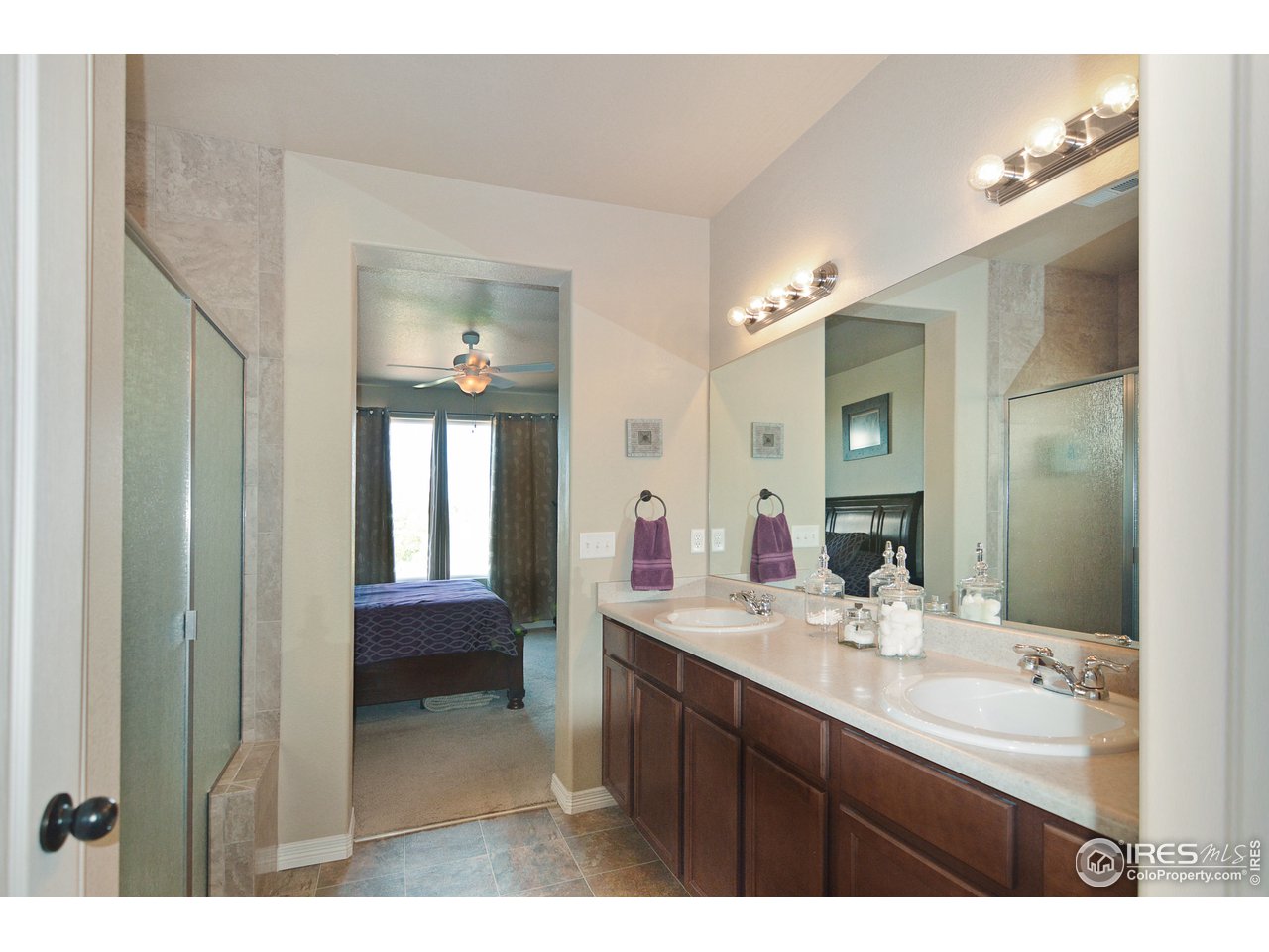2045 Reed Grass Way Colorado Springs, CO 80915 - Photo 16 of 33 a bathroom with a sink a toilet and a mirror