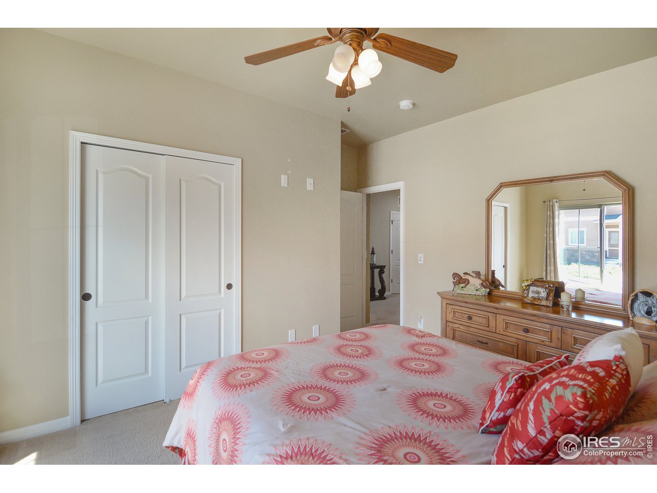 2045 Reed Grass Way Colorado Springs, CO 80915 - Photo 21 of 33 a bedroom with a bed dresser and window