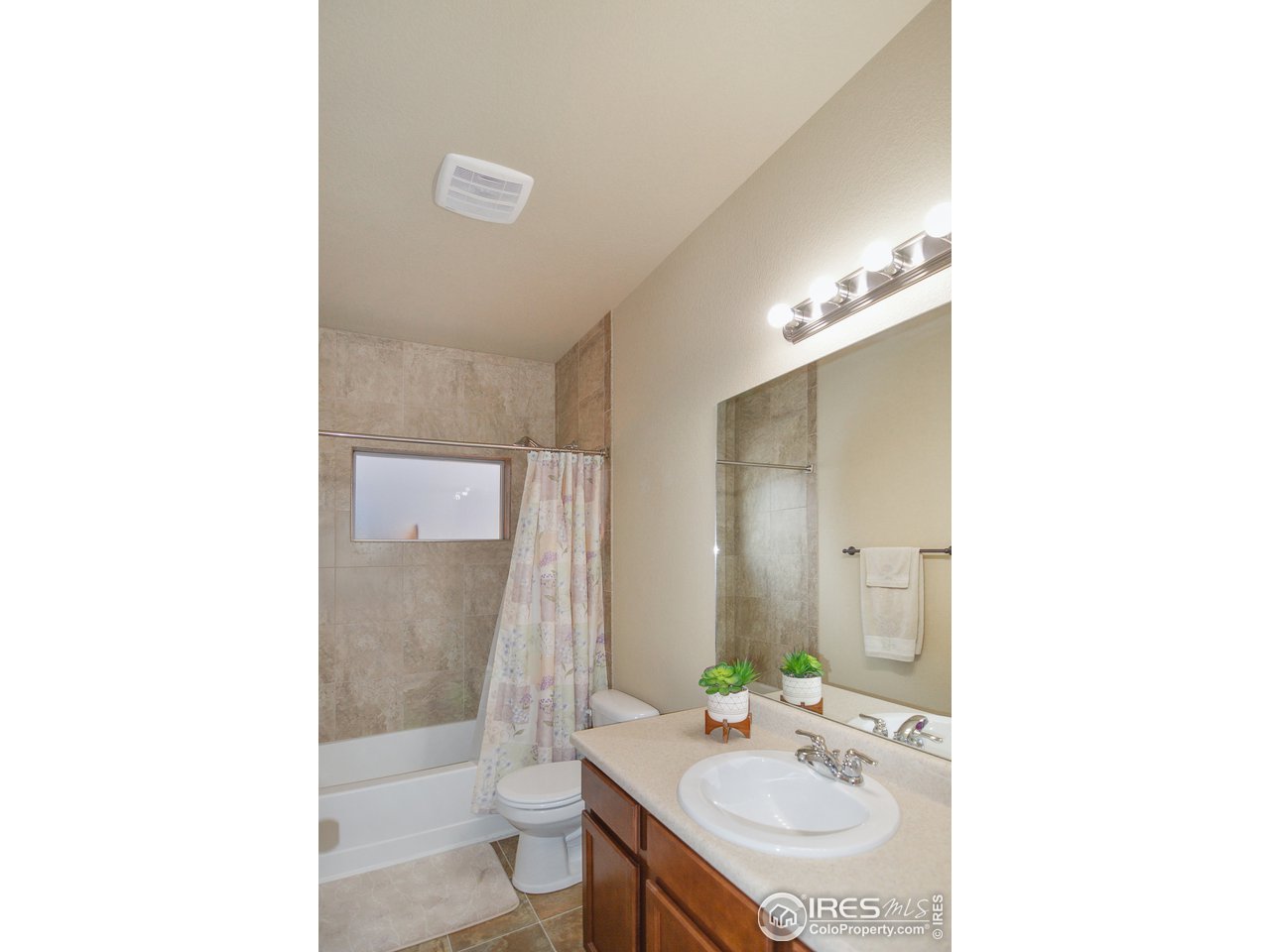 2045 Reed Grass Way Colorado Springs, CO 80915 - Photo 22 of 33 a bathroom with a sink double vanity and a mirror