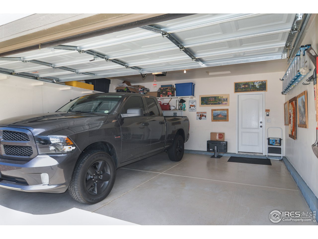 2045 Reed Grass Way Colorado Springs, CO 80915 - Photo 27 of 33 a view of a garage and car parked