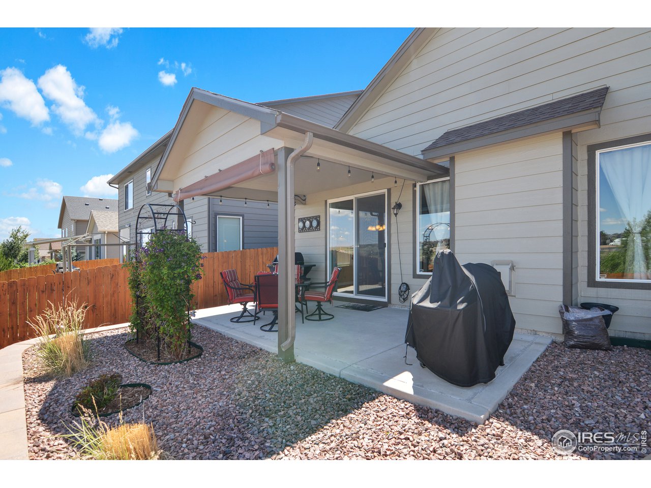 2045 Reed Grass Way Colorado Springs, CO 80915 - Photo 28 of 33 a view of a house with backyard and porch