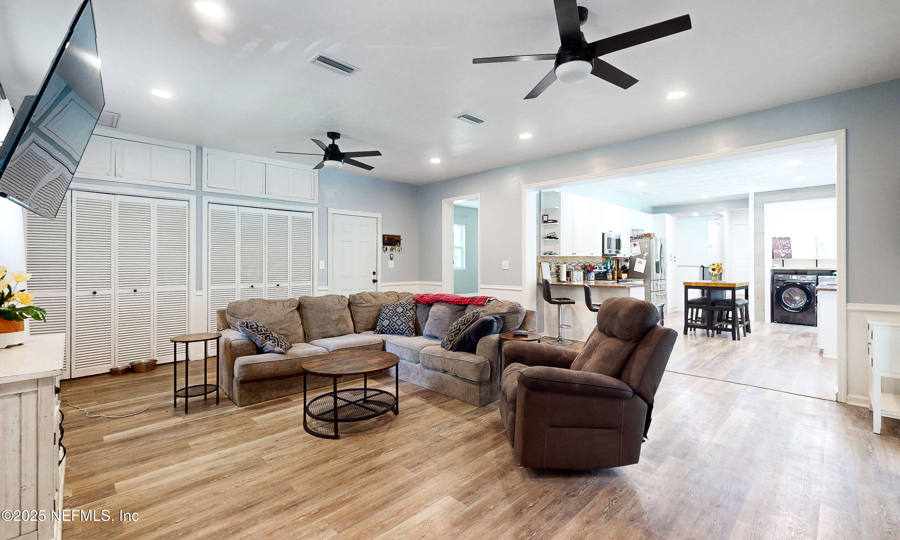 90 Forest Street Keystone Heights, FL 32656 - Photo 13 of 42 a living room with furniture and a wooden floor