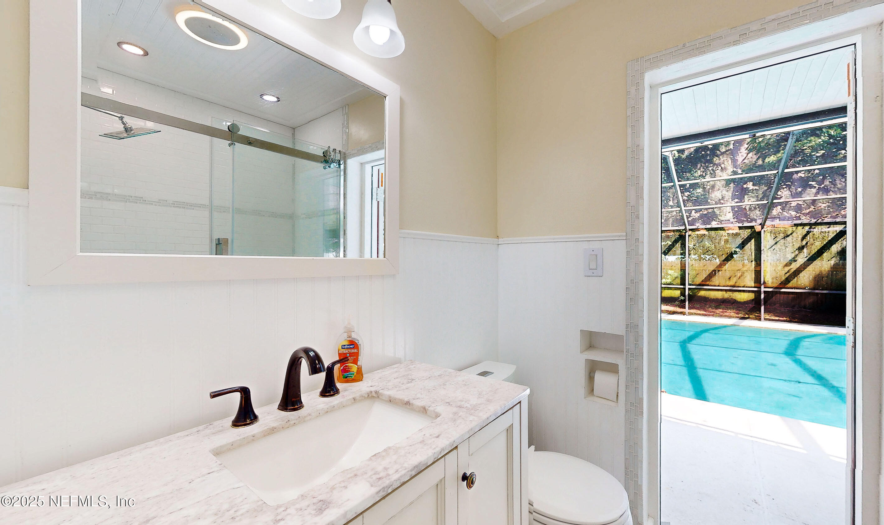 90 Forest Street Keystone Heights, FL 32656 - Photo 15 of 42 a bathroom with a granite countertop sink mirror vanity and toilet