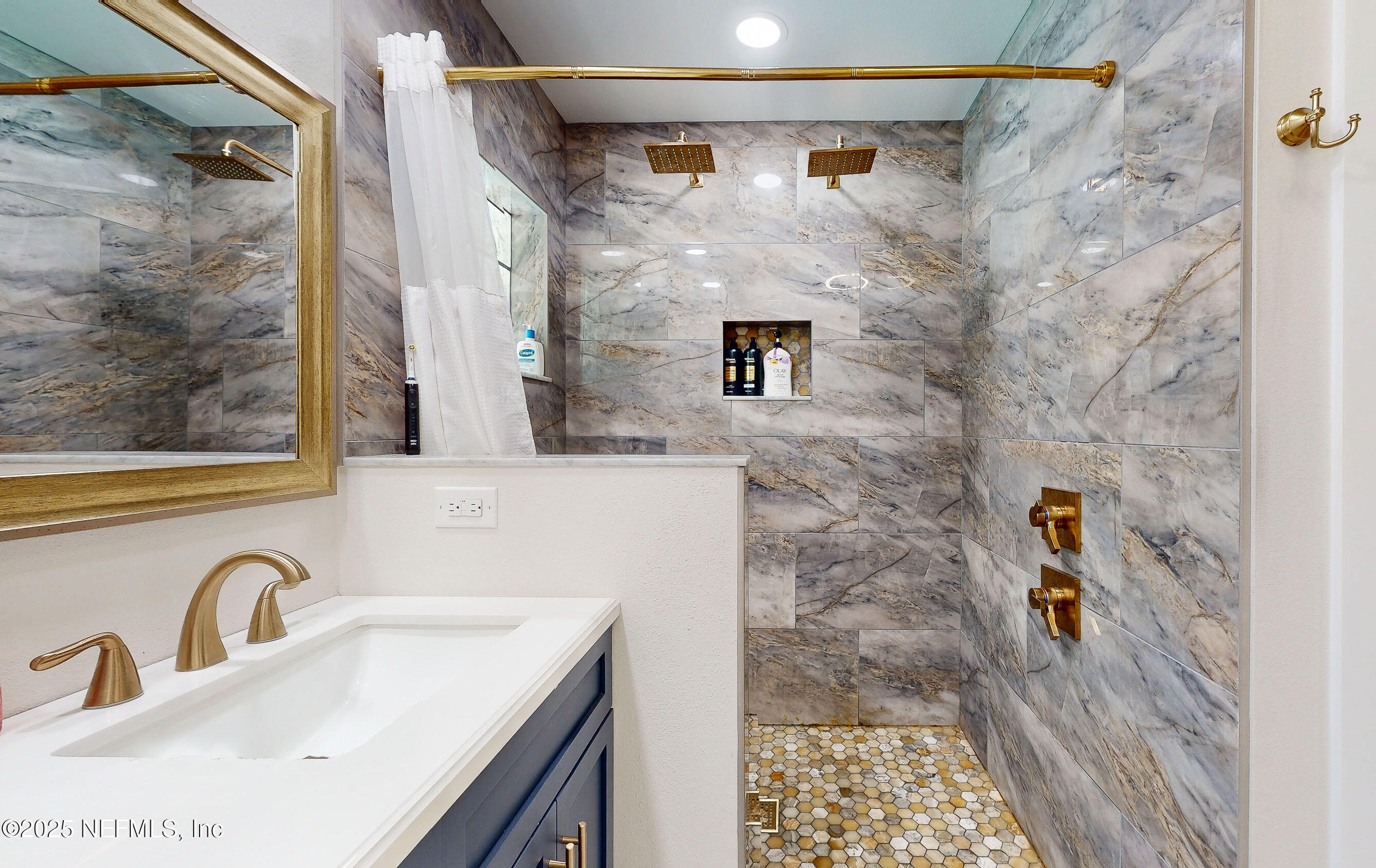 90 Forest Street Keystone Heights, FL 32656 - Photo 23 of 42 a bathroom with a sink and a mirror