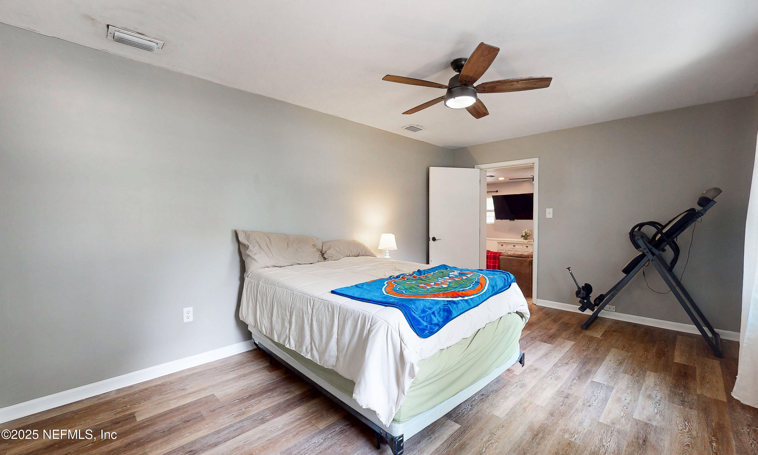 90 Forest Street Keystone Heights, FL 32656 - Photo 25 of 42 a bedroom with a bed and a table