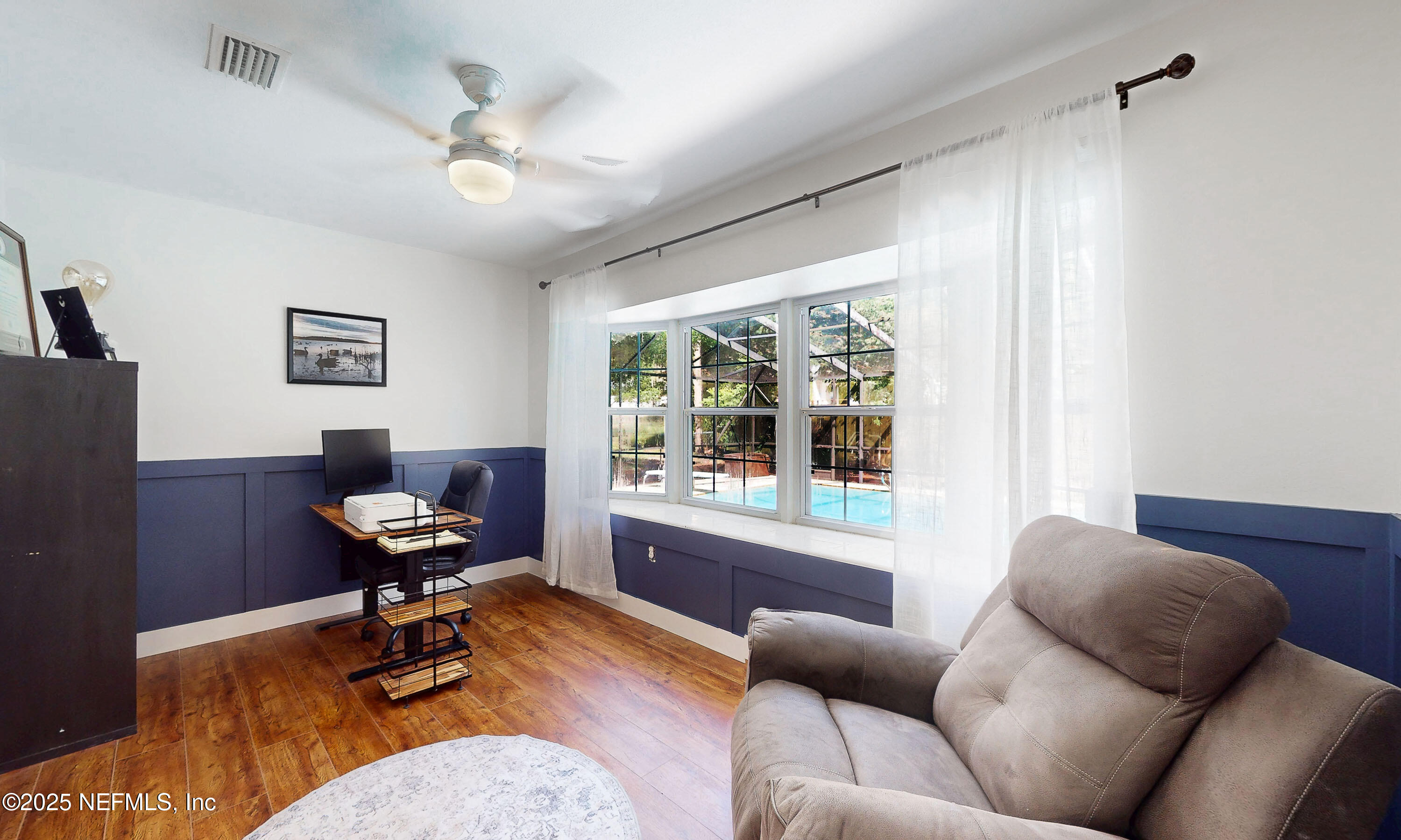 90 Forest Street Keystone Heights, FL 32656 - Photo 29 of 42 a living room with furniture and a window
